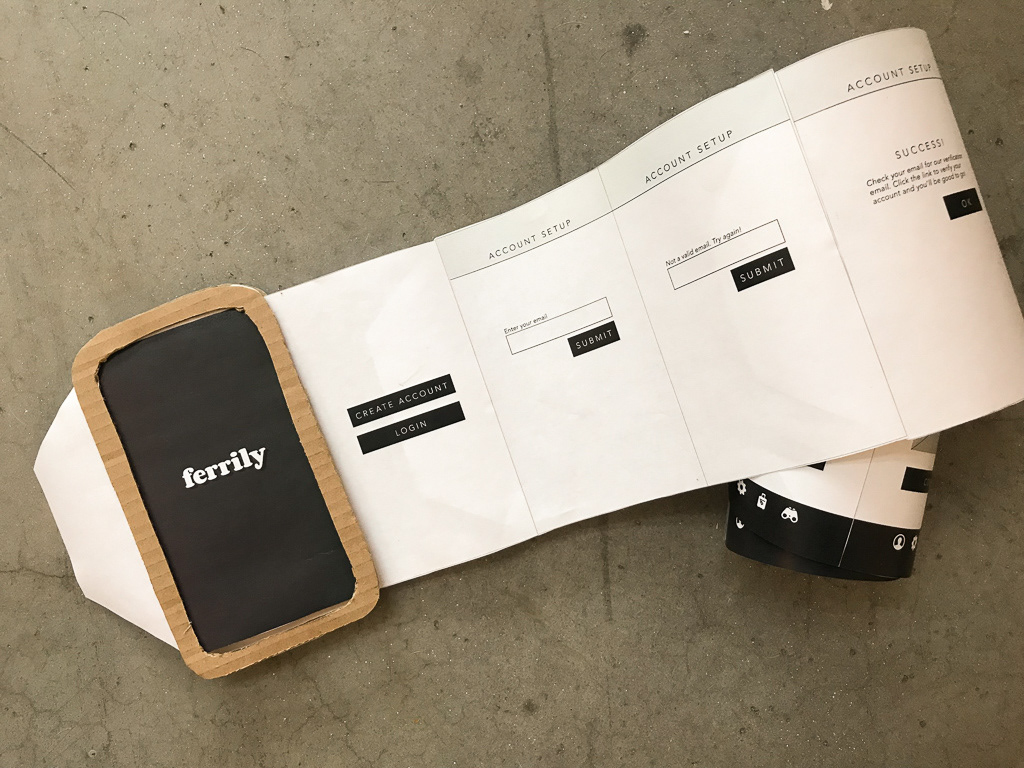 The paper prototype featured a roll of printed screens that advanced by pulling the tab to the left of the corrugated cardboard frame.