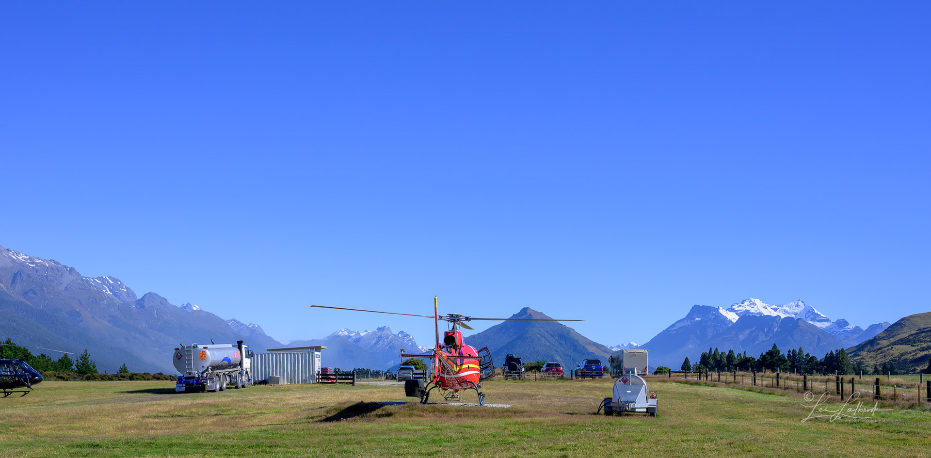 This is one of the two Squirrel Helicoptors, the other black one can be seen on the far left.