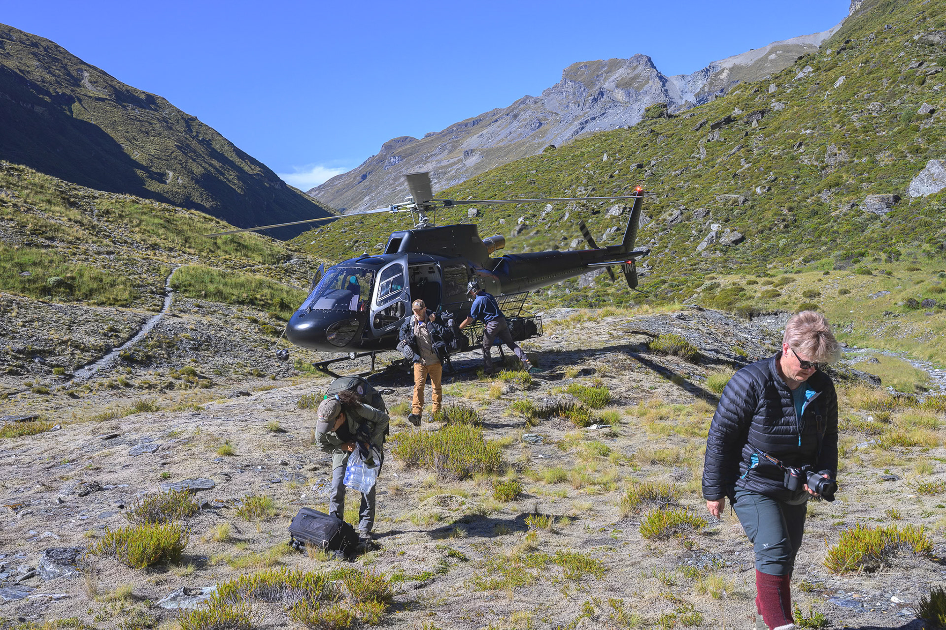 Alighting from the helicopter.