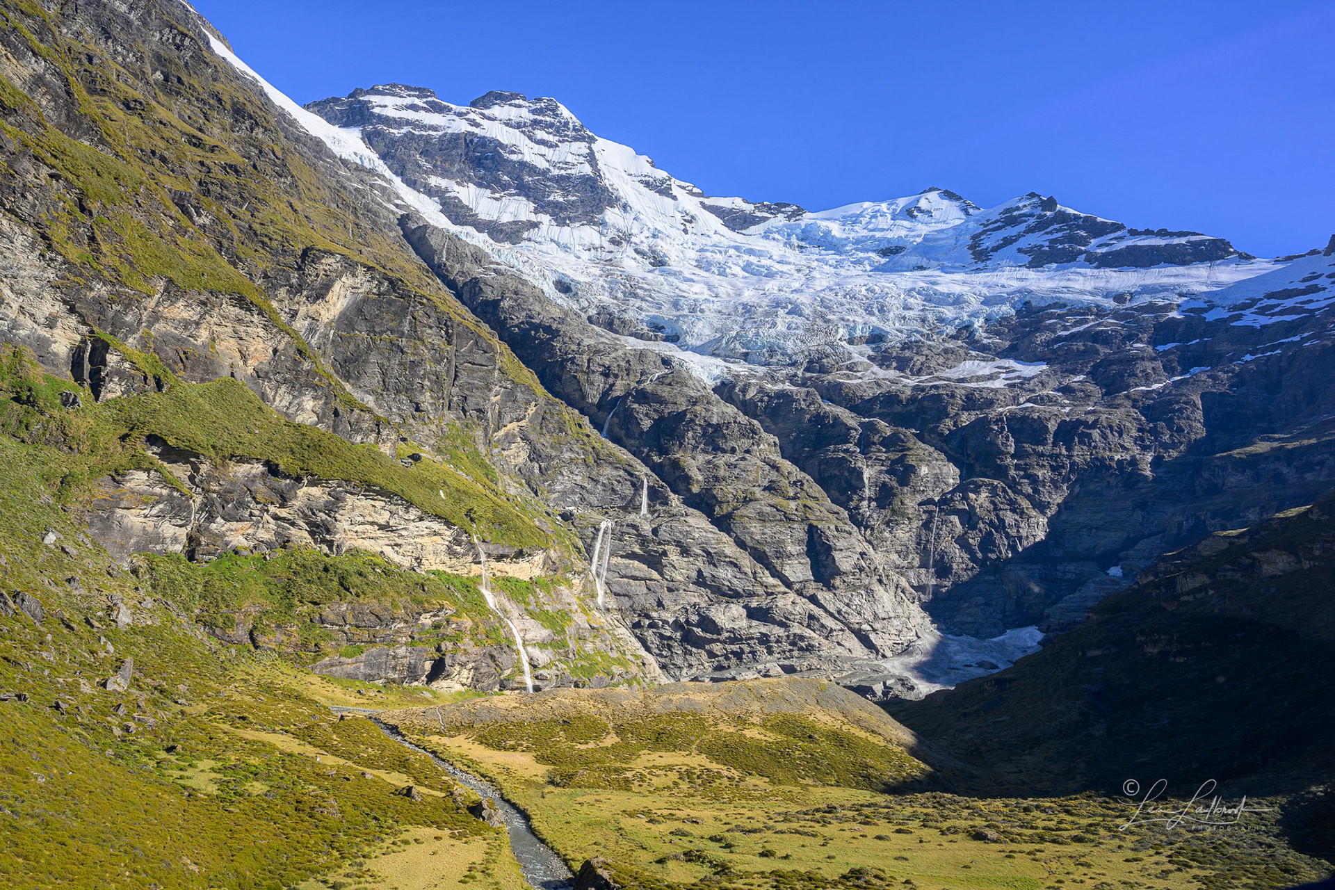 Looking at the head of the valley and the Earnslaw Burn glacier.  We land just over the ridge in the foreground.