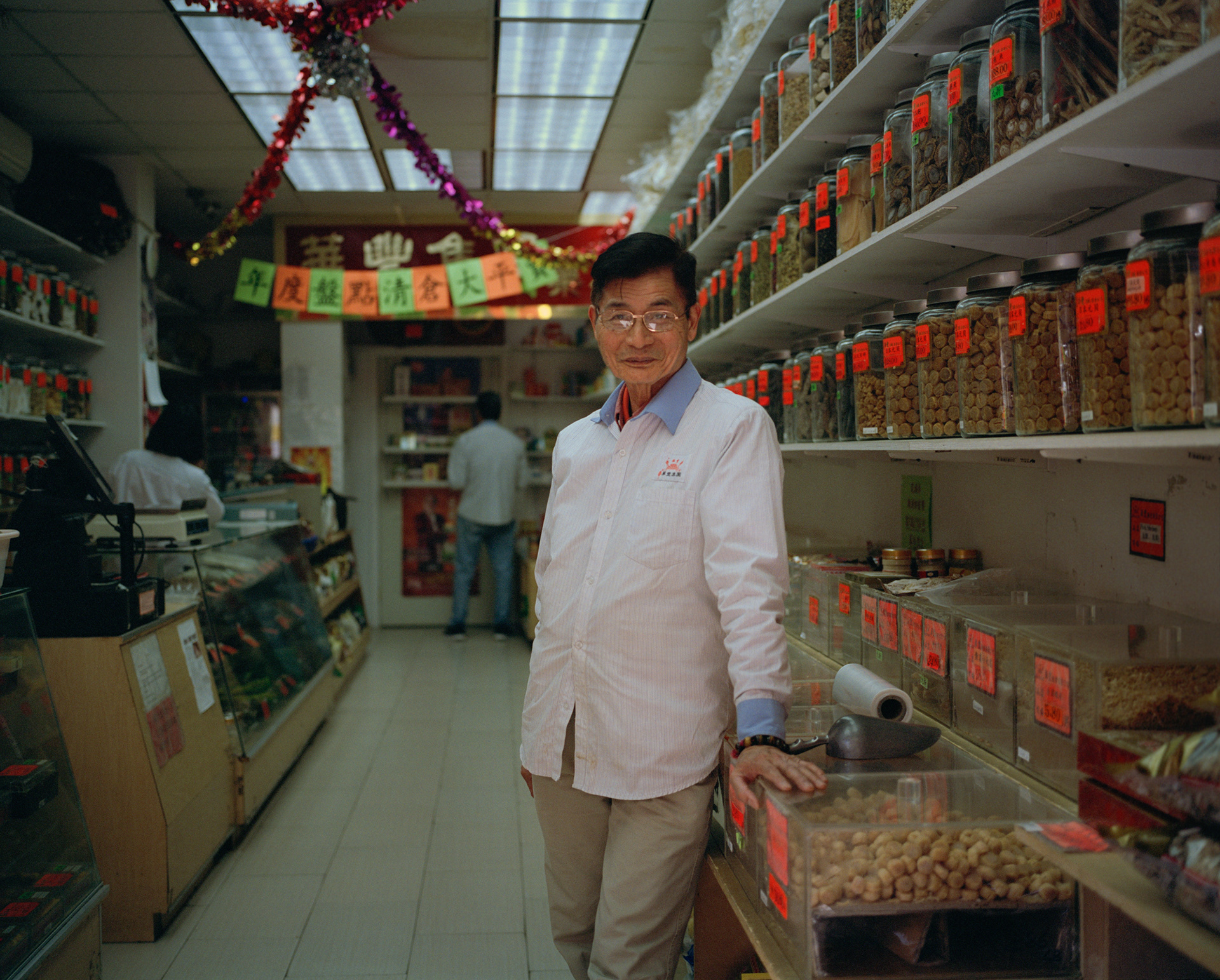 Bayard Street // Owner of 7955 AE Company Inc. stands in front of his Chinese medicines