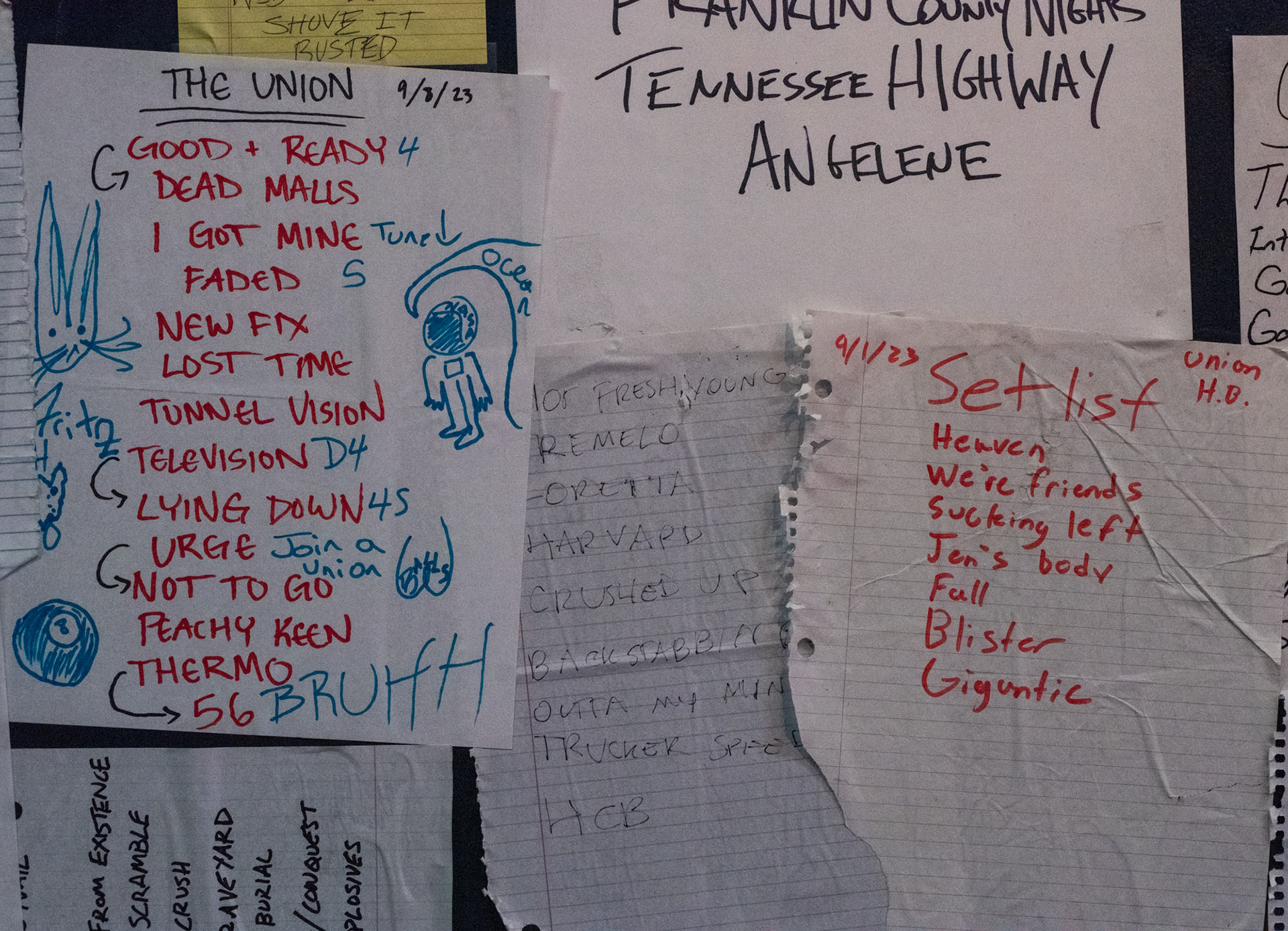 Set lists located on either side of the alcohol cabinets in the upstairs bar at The Union in Athens, Ohio, Sept. 26, 2023. The Union tries to limit the amount of branding in the bar, plus the bands who play at The Union get a little space of fame on the wall. “It is cool to see your set list up there with your friend’s band/a touring you loved,” Michael Bart said.