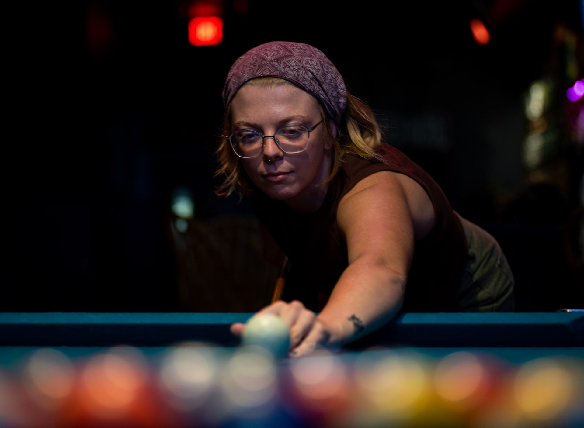 Trynsery Wright playing pool with her friends at the downstairs Union bar, located in Athens, Ohio, Sept. 23, 2023. “We like to come to The Union, because it is peaceful and they always have good deals plus we can play pool,” Trynsery Wright said.