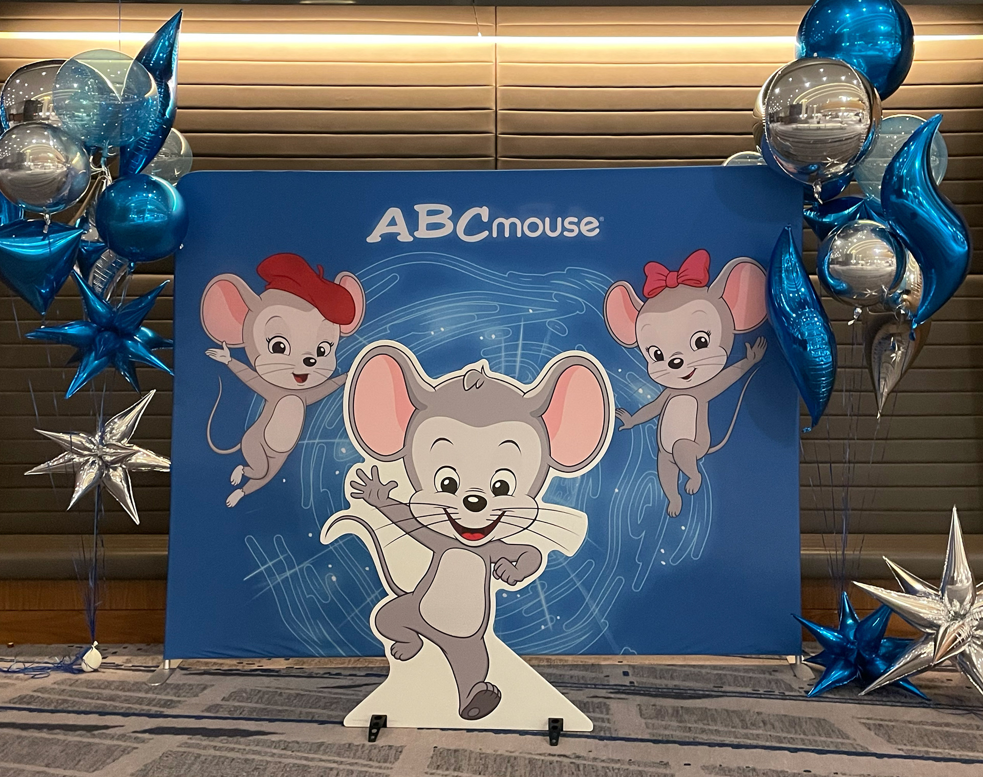 POLYETHYLENE STANDEE AND DYE-SUB BACKDROP