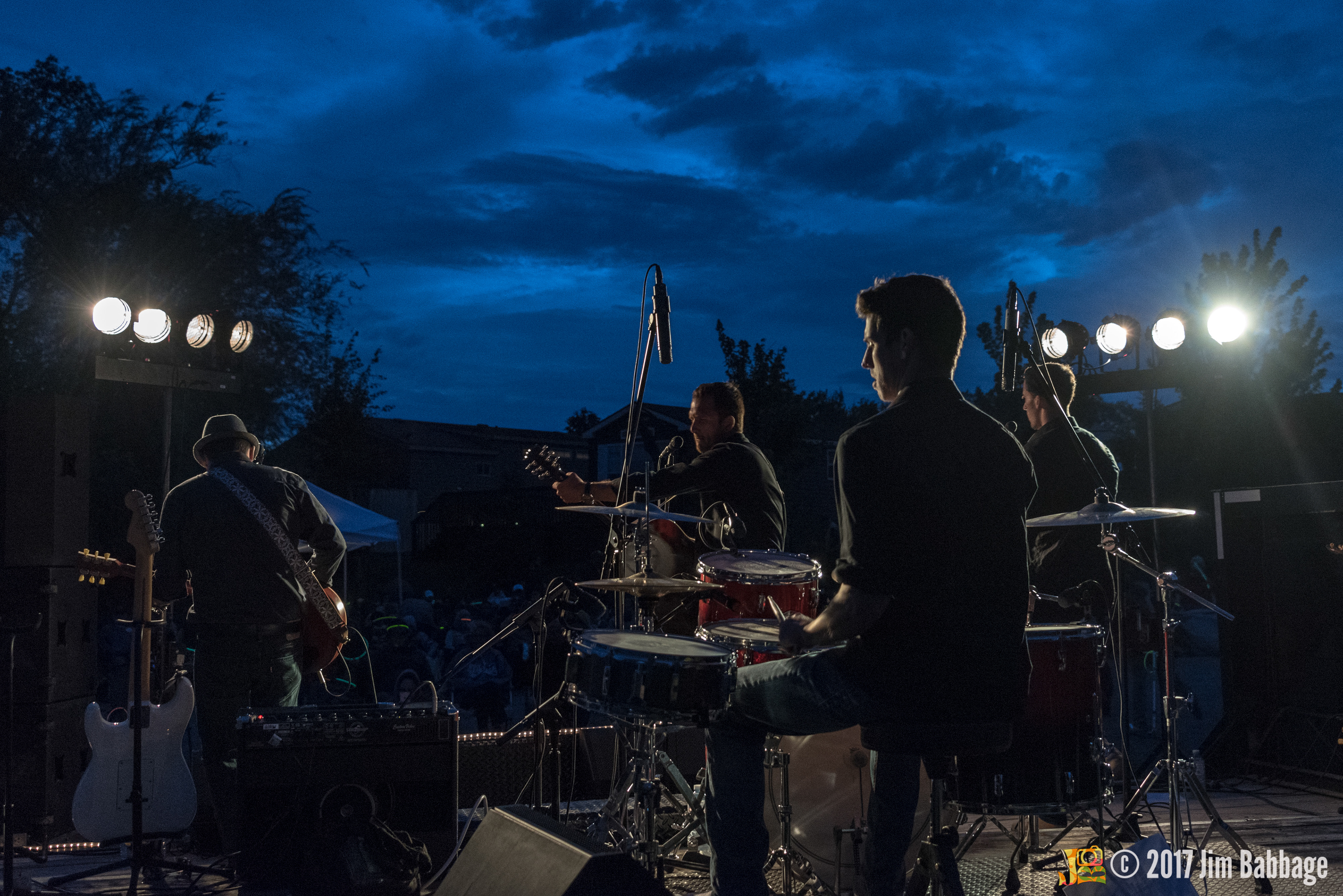 View of the band performing from behind the stage