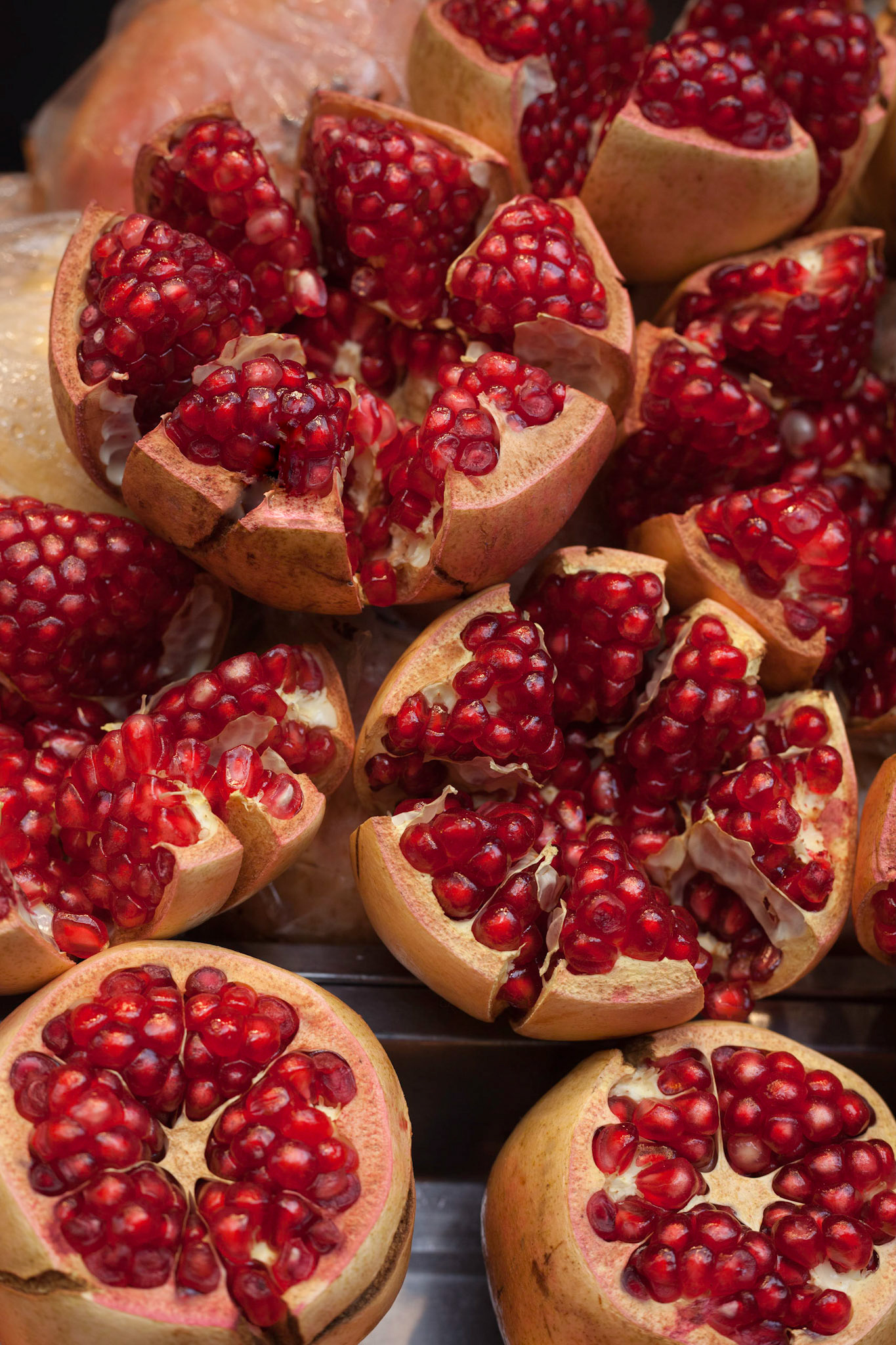 These pomegranates with their jewel-like seeds await juicing at a vendor's stall in the Muslim Quarter market, at the end of the Silk Road, Xi'an, China.