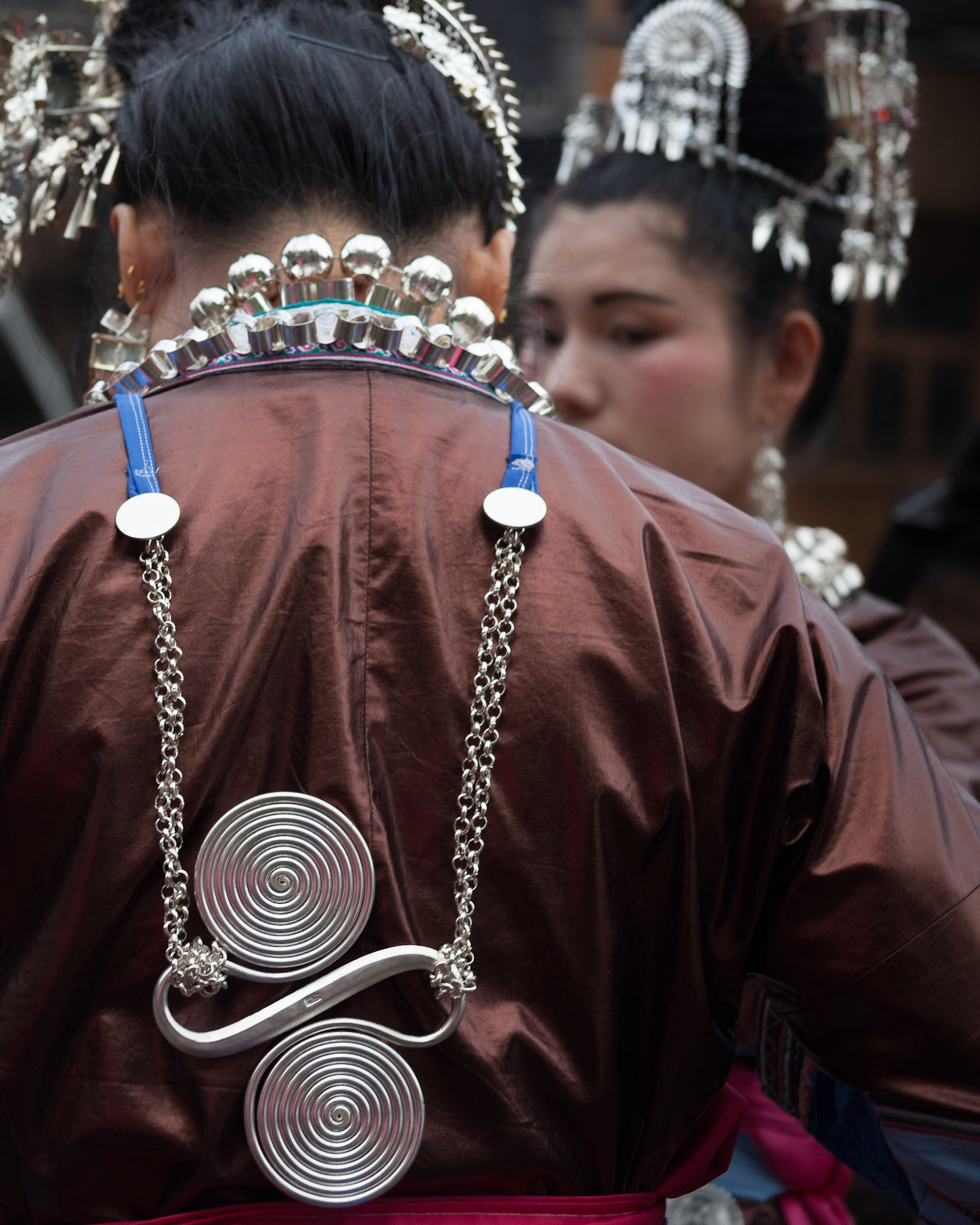 Dong performers with silver jewelry