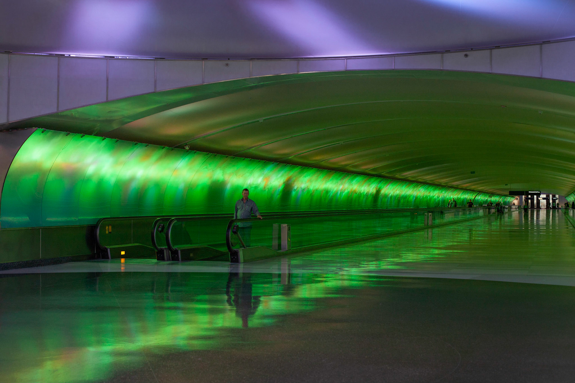 Traveler exiting from McNamara Tunnel linking connecting flight in different areas of the Detroit airport.