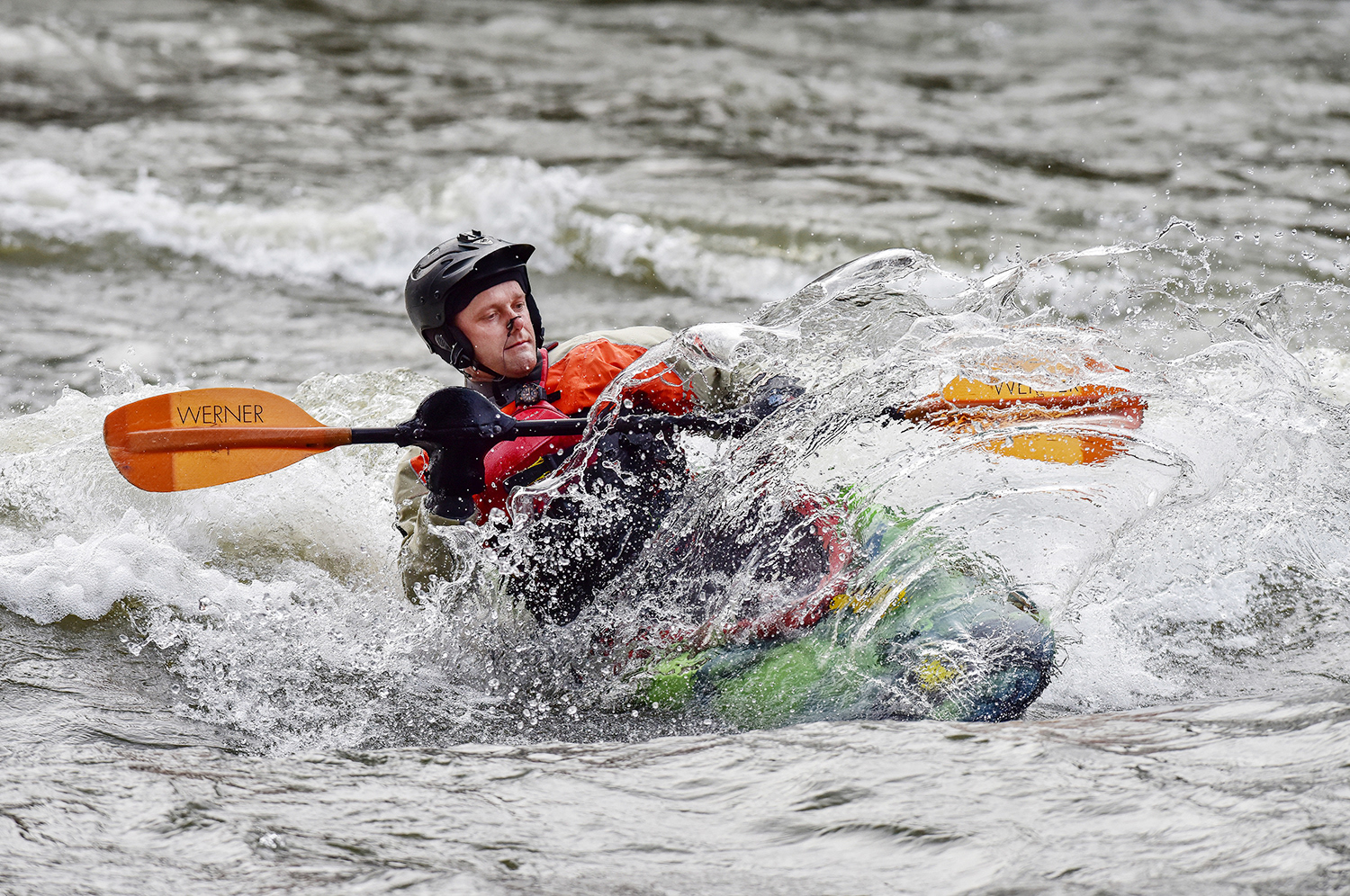 Richie Gardner surfs a wave in his kayak on Monday, April 1, 2019, in the Umatilla River in Pendleton.