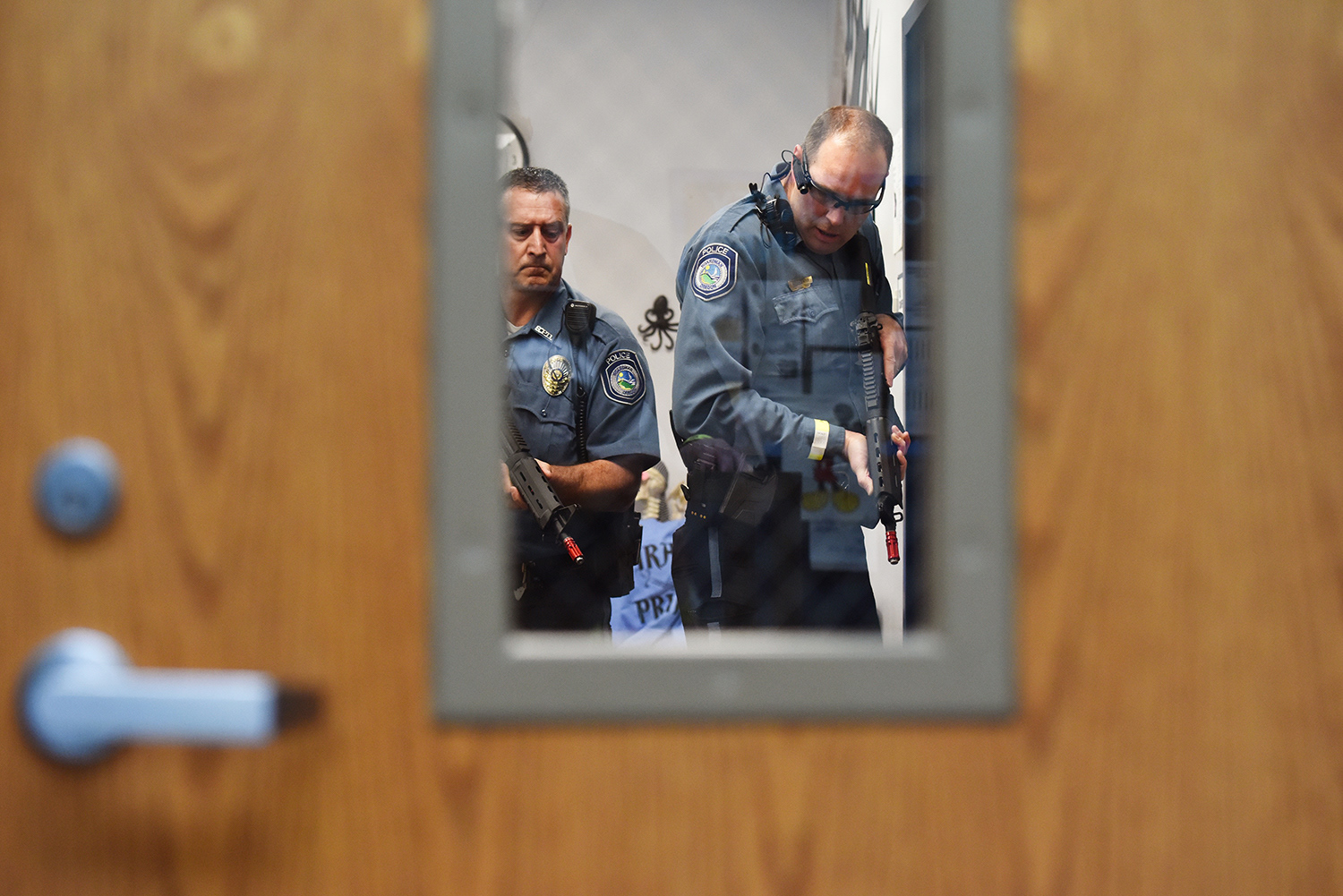 Boardman Police officer Corey Rose, left, and Lt. Loren Dieter engage with a hostage taker during an active shooter drill Friday, April 13, 2018, at Riverside High School in Boardman, Oregon. More than 400 school officials, students and law enforcement officers participated in the exercise. 