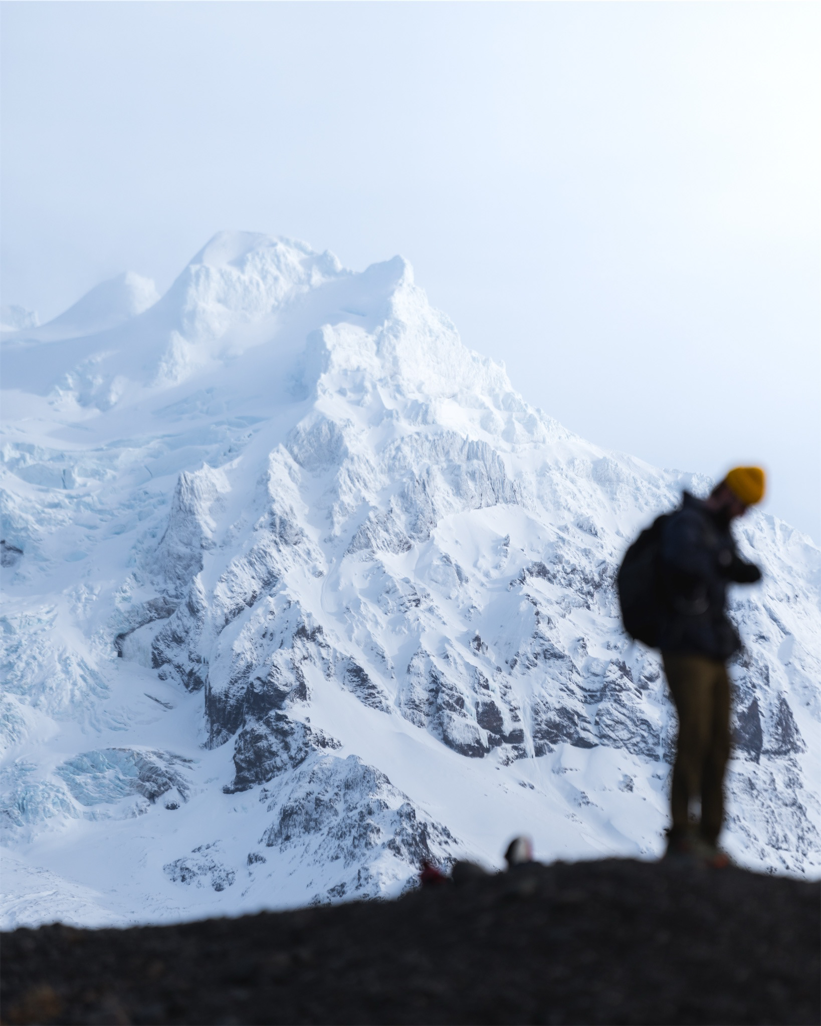 Human showing scale of Iceland mountain in Skaftafellsjökull Glacier