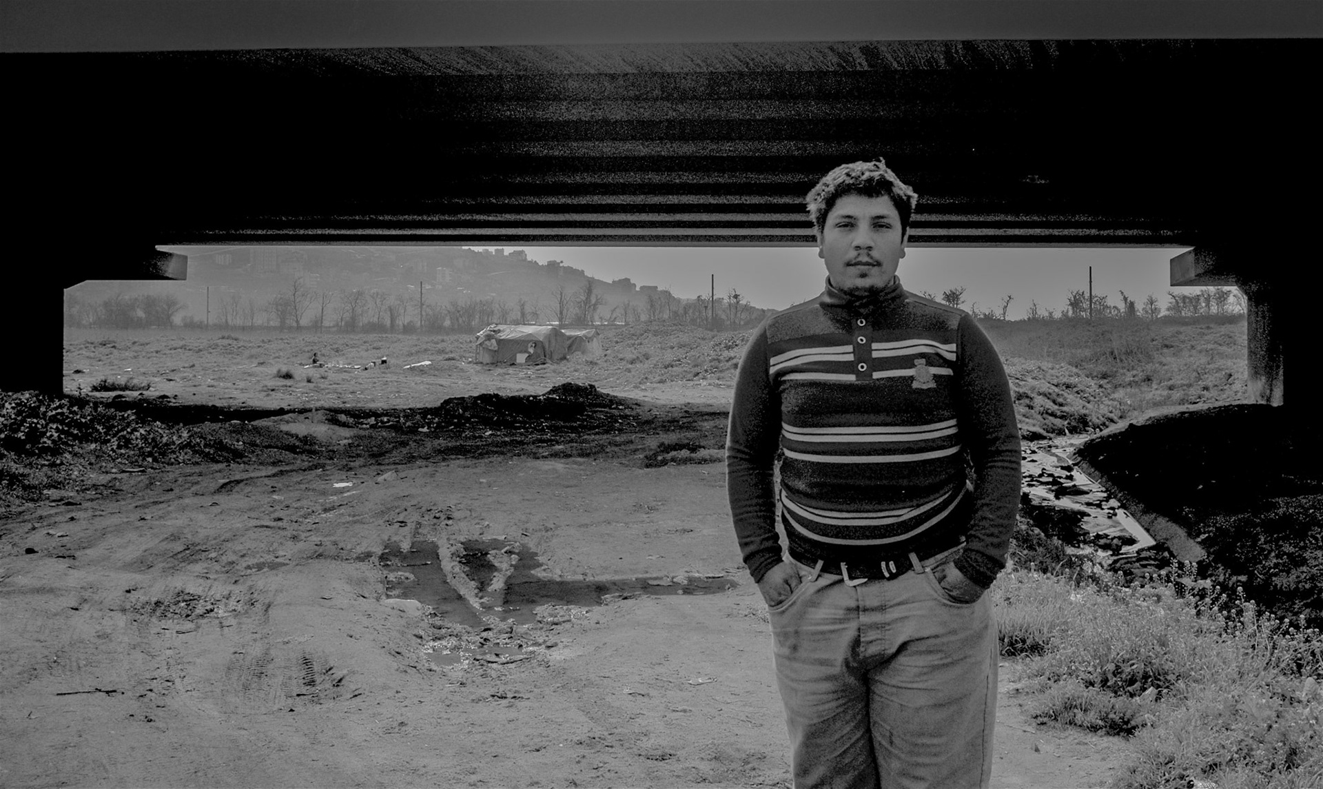 Altınşehir: a young Roma man living with his wife and baby in the shack in the middle of the photo, almost under the Avrupa Otoyolu