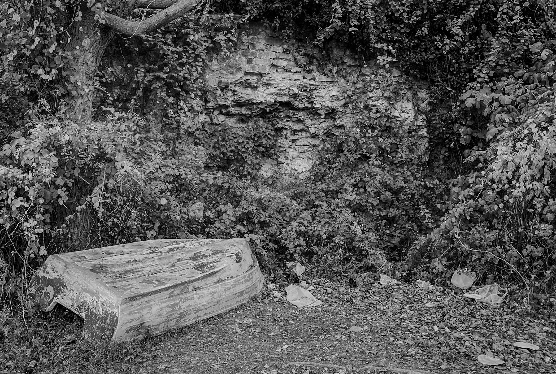 Trikos promontory: part of the old wall and a boat