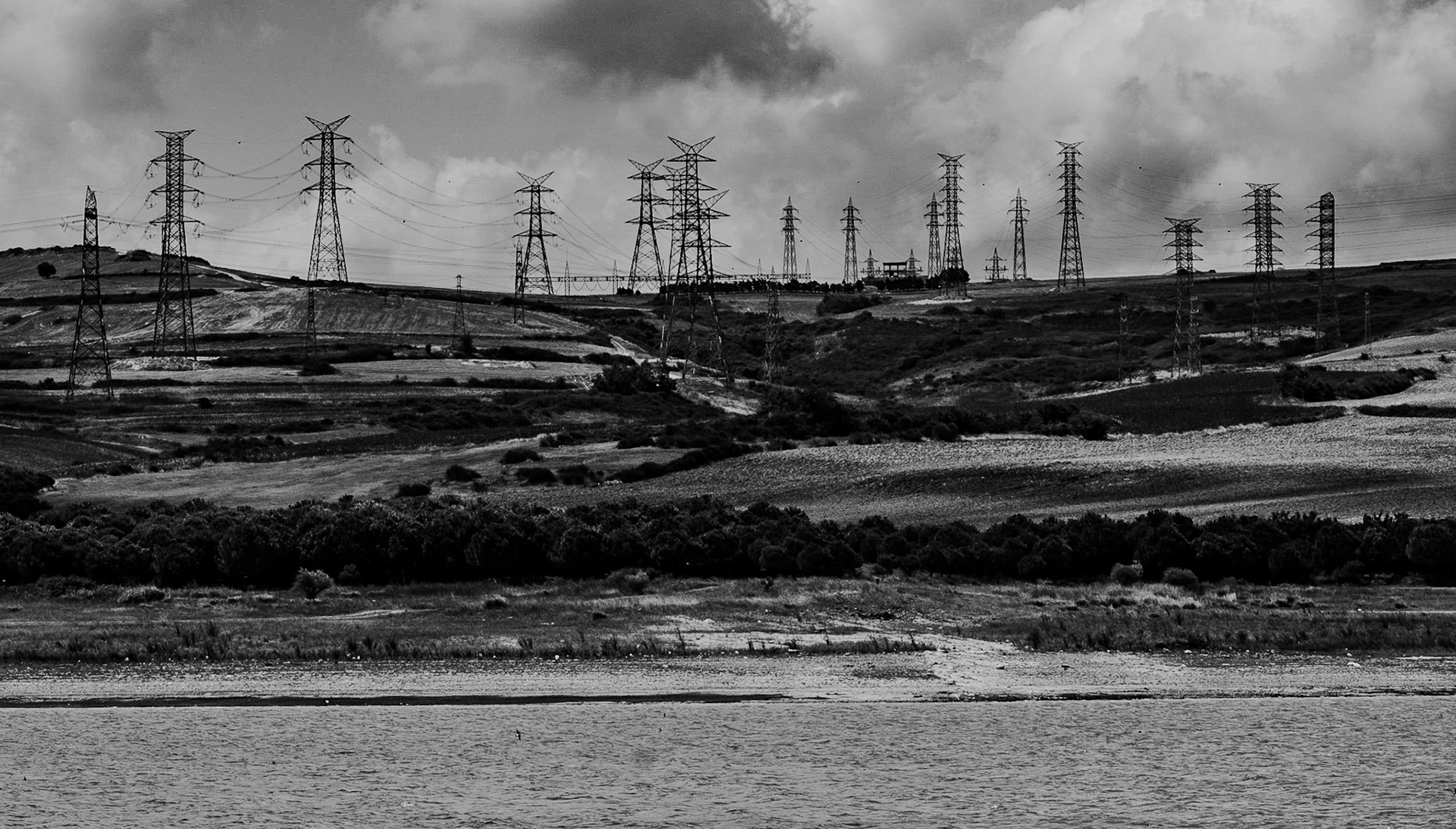 the Sazlıdere Reservoir: pylons lined along the hill on the western side of the valley