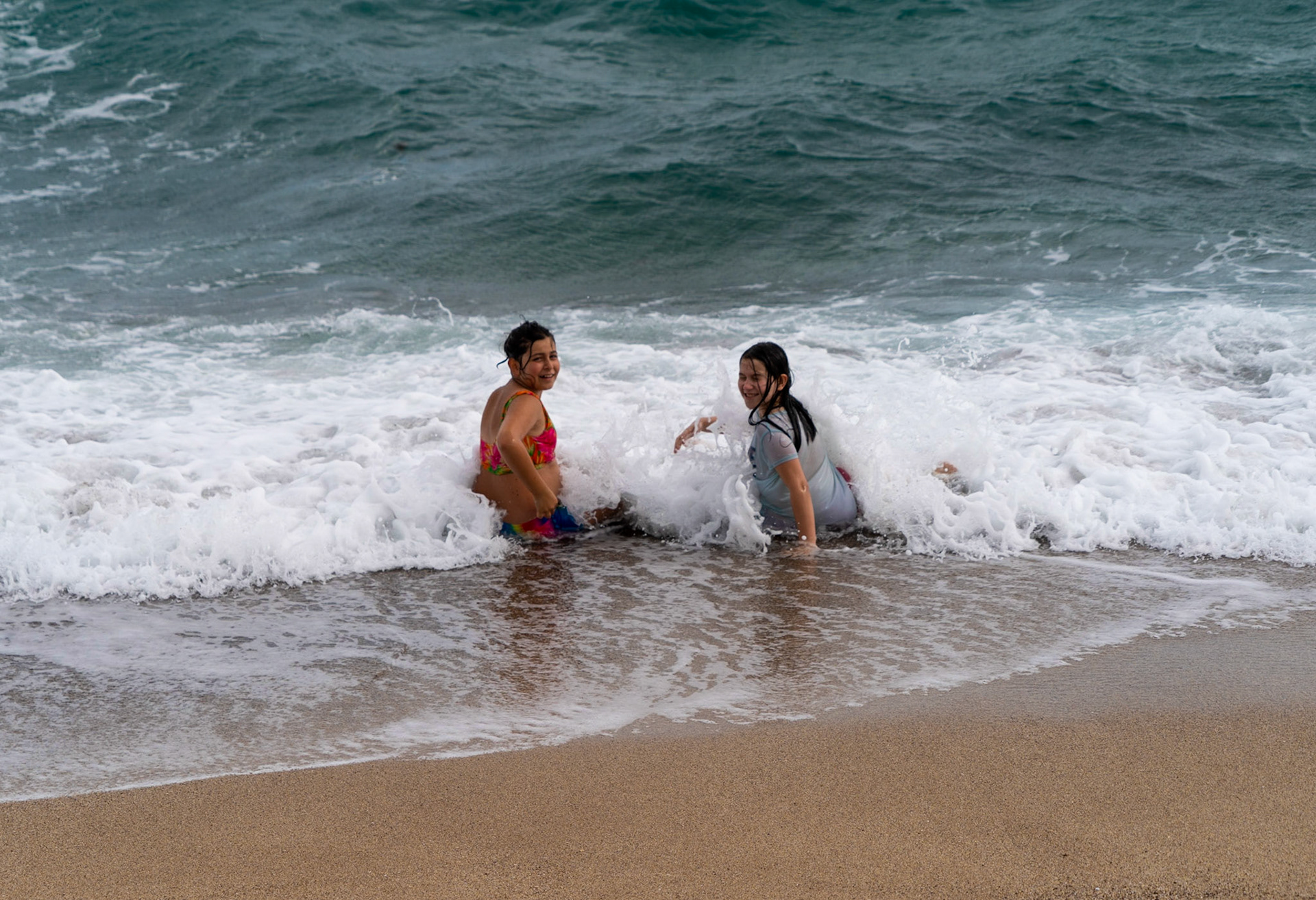 the beach just east of Sahil Kamp: two delightful girls in the sea