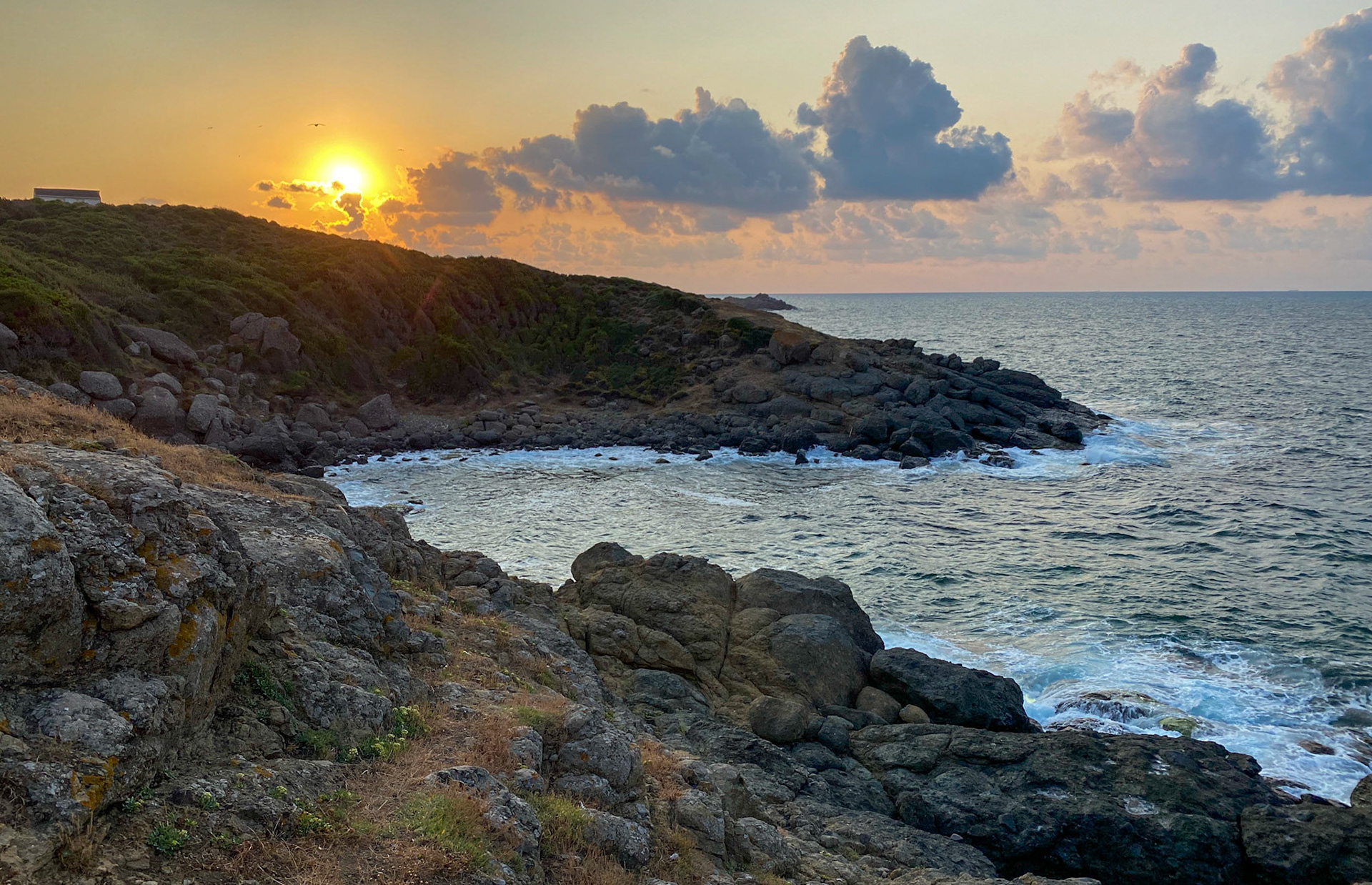 between the 'English' houses and Riva: the setting sun looking west along the shore