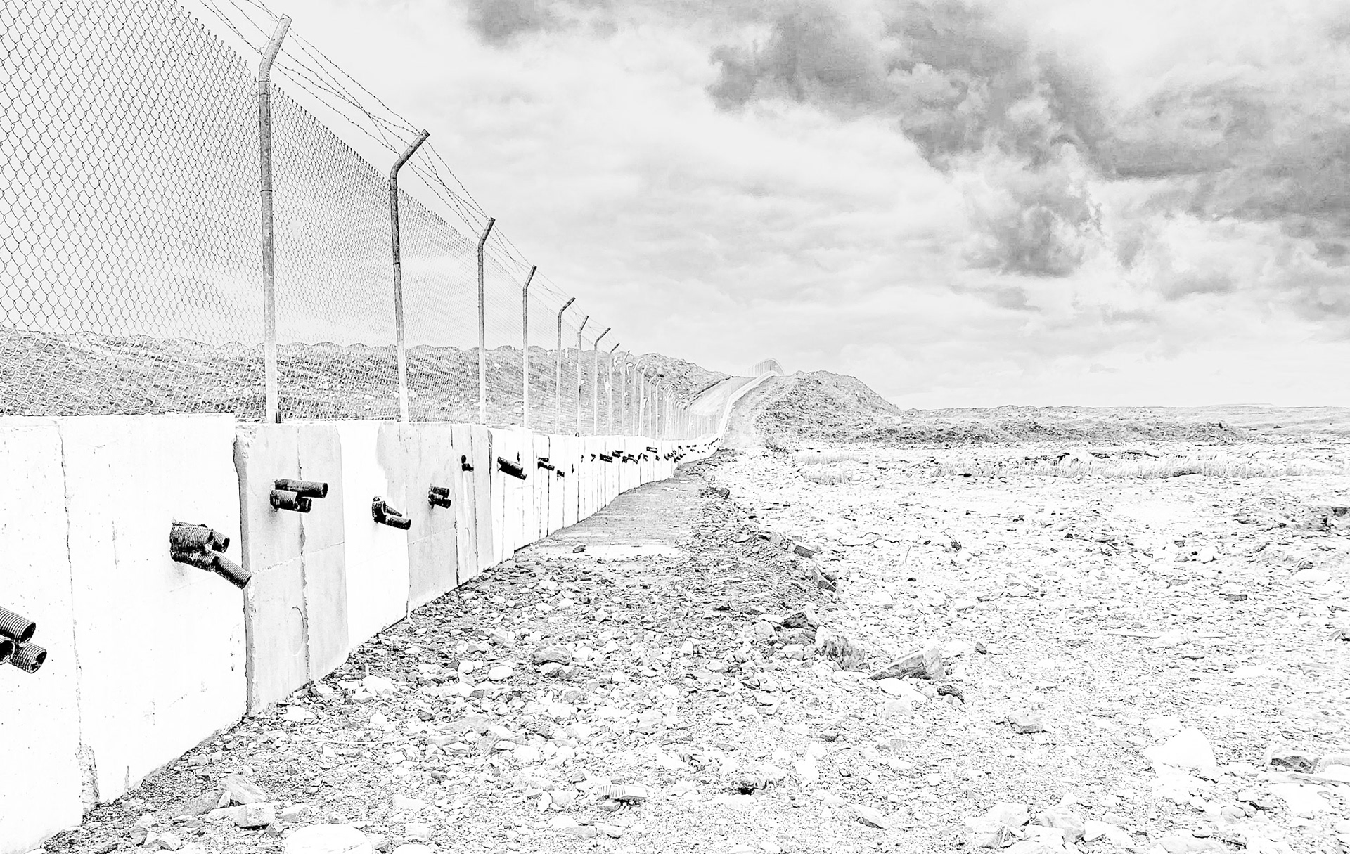 Yeniköy active mining area: concrete wall and fence