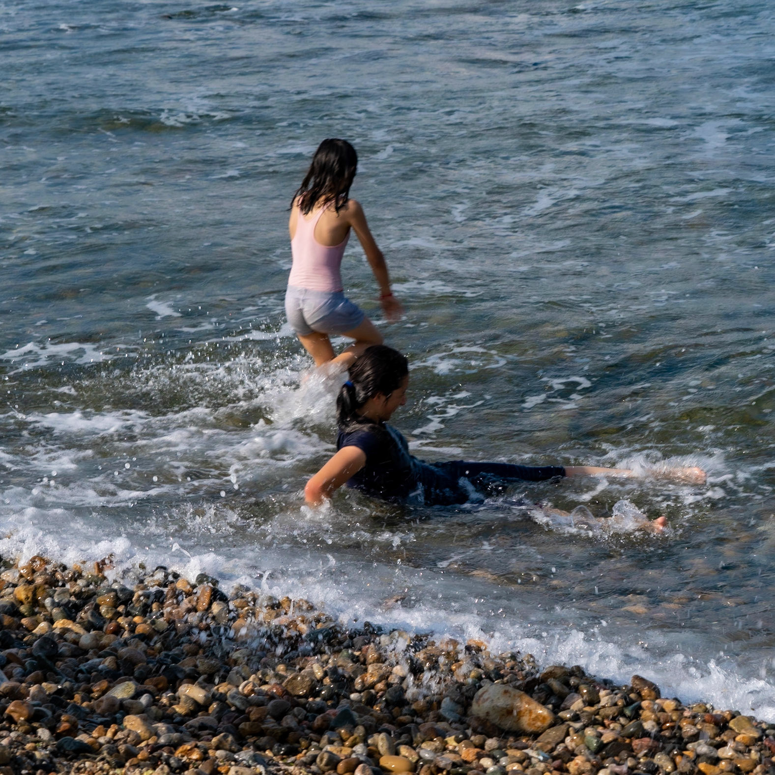 between Kurna abandoned quarry and the 'English' houses: two girls playing on the edge of the sea at Middle bay