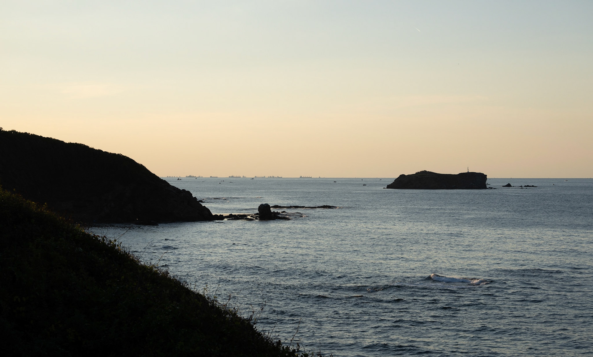 heading west along the line of the Black Sea: cargo ships waiting to enter the Bosphorus