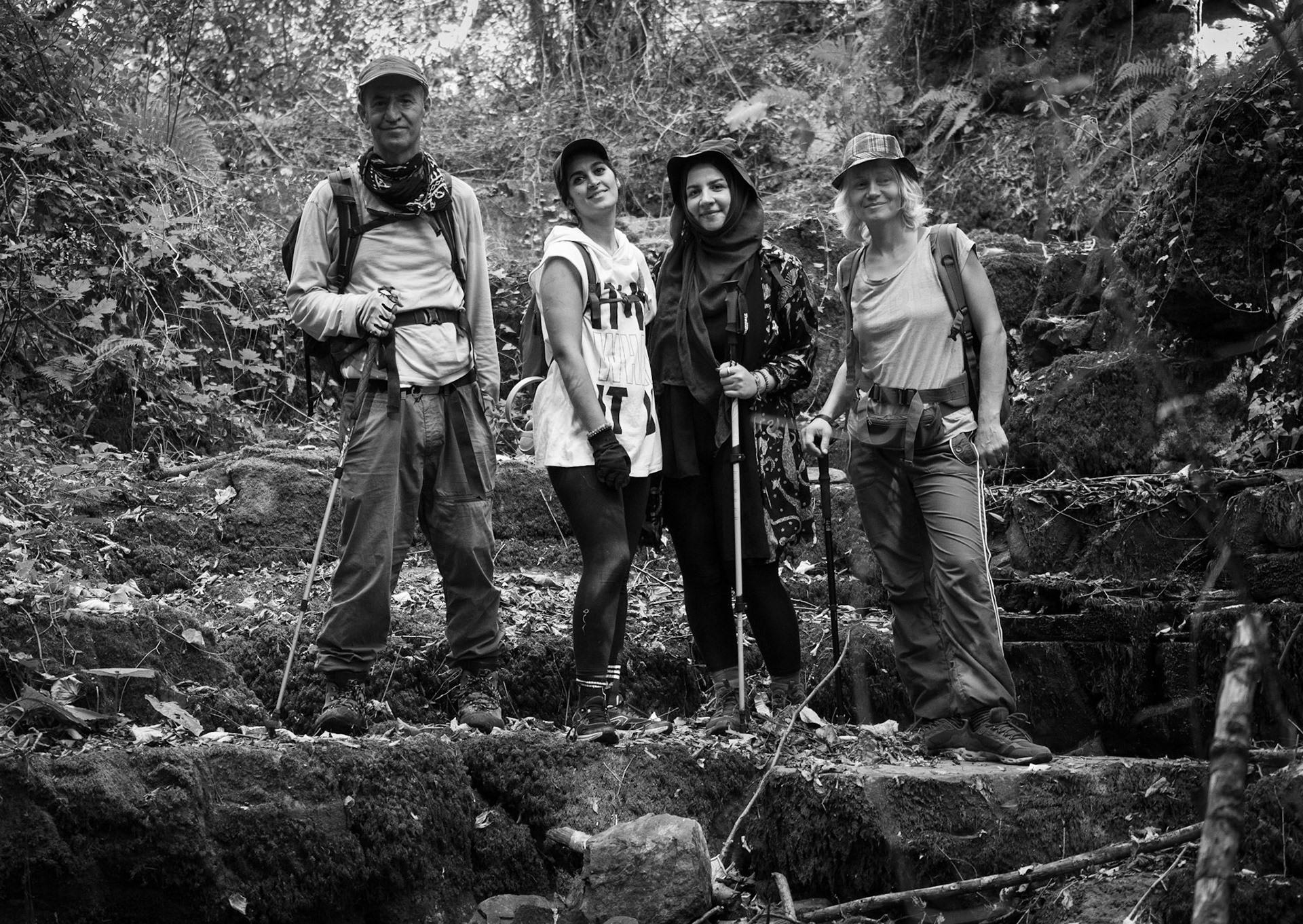 Ayhan Şahenk ledged streambed: today's hikers pose on a rocky step