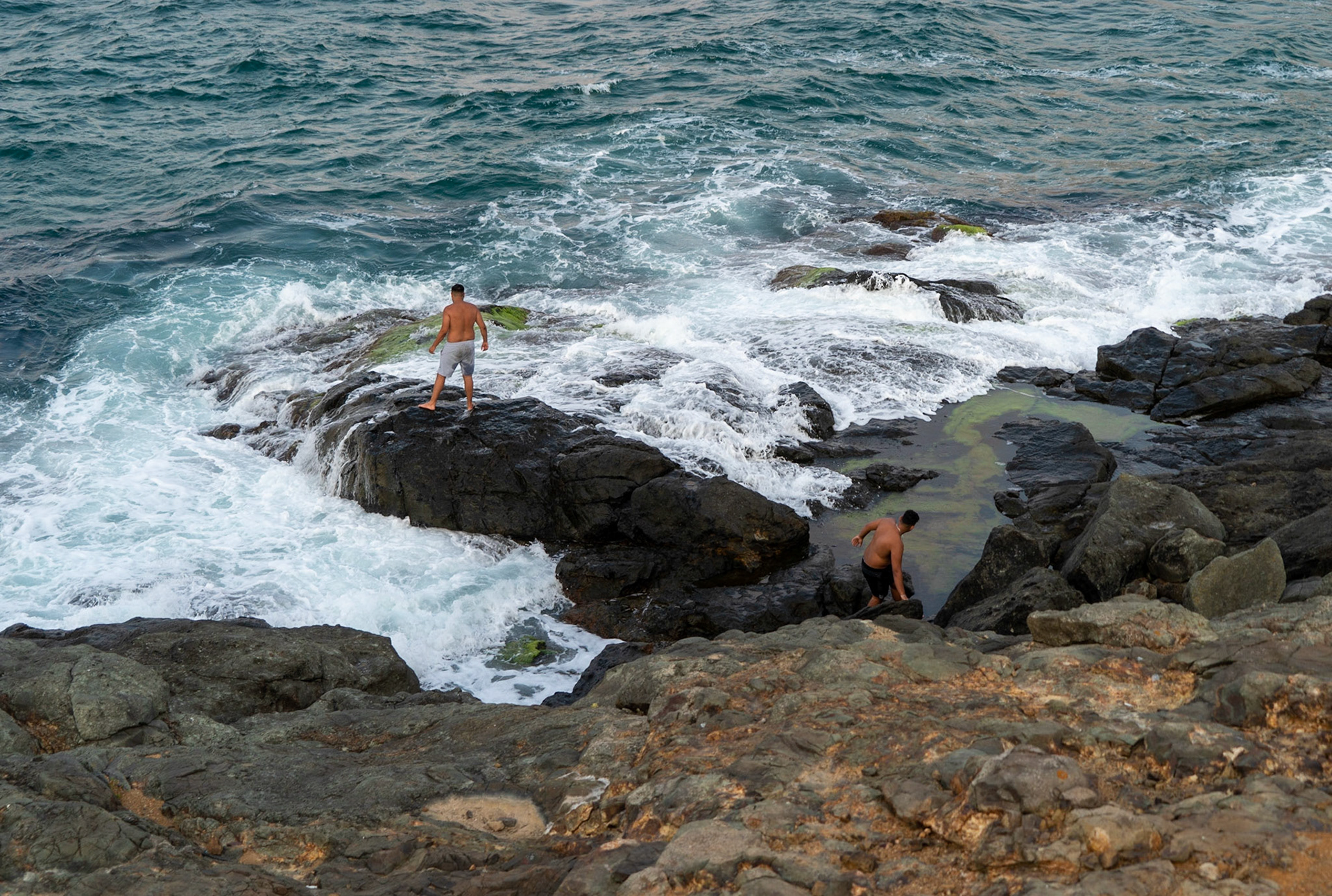 between the 'English' houses and Riva: two men at one with the elements