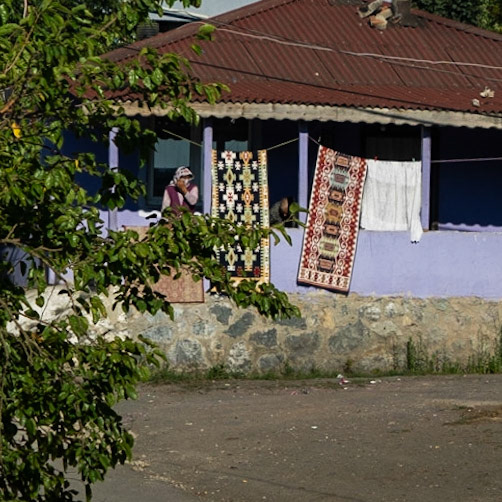 Nişantepe: woman and carpets