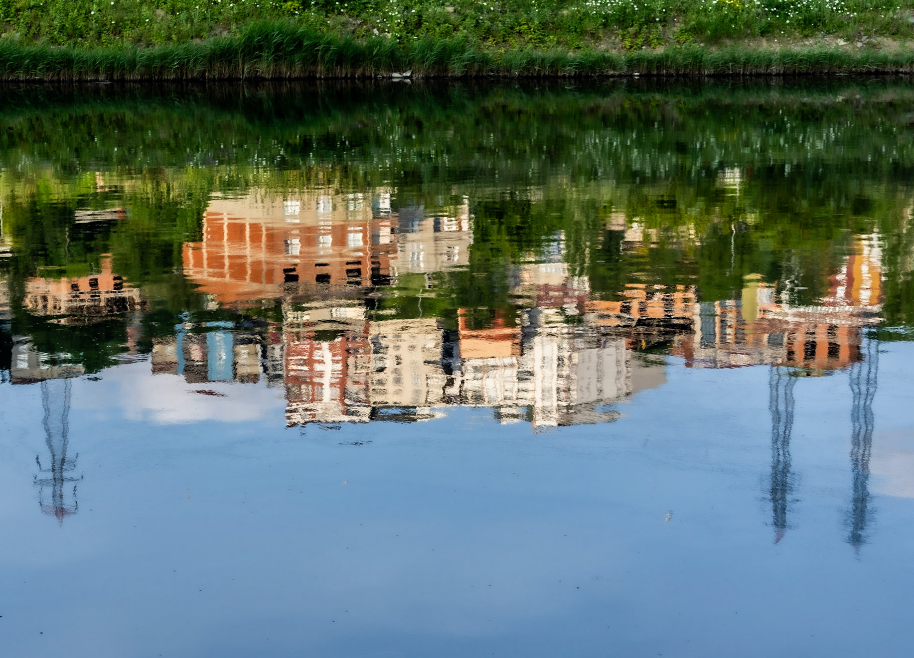Sazlıdere river walk: reflected houses and pylons