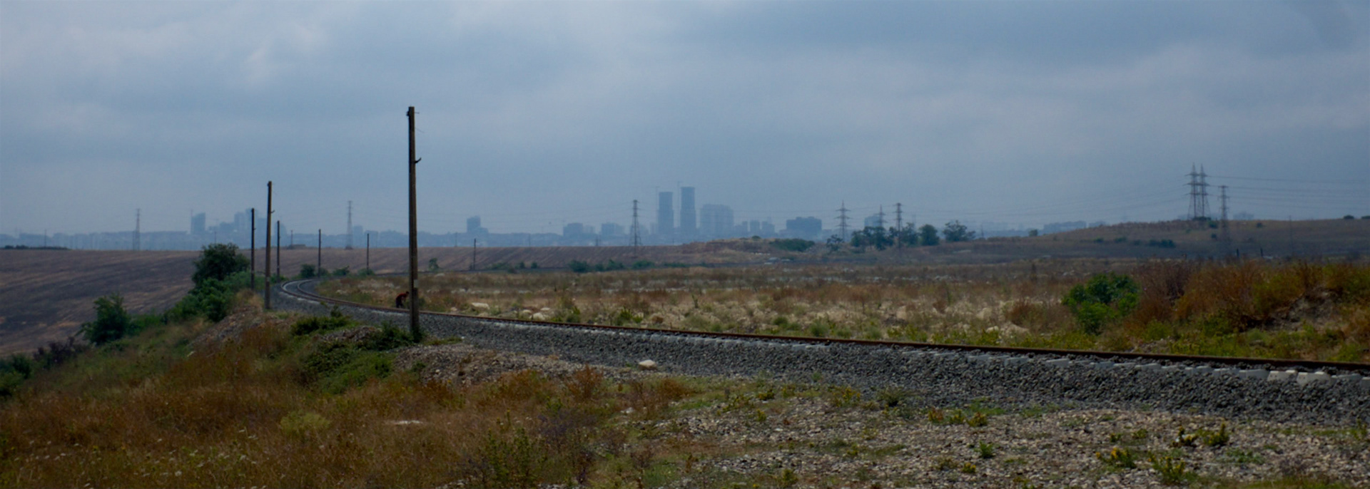 Bahçeşehir seen over the single-track railway line at the NW edge of Küçükçekmece marshes