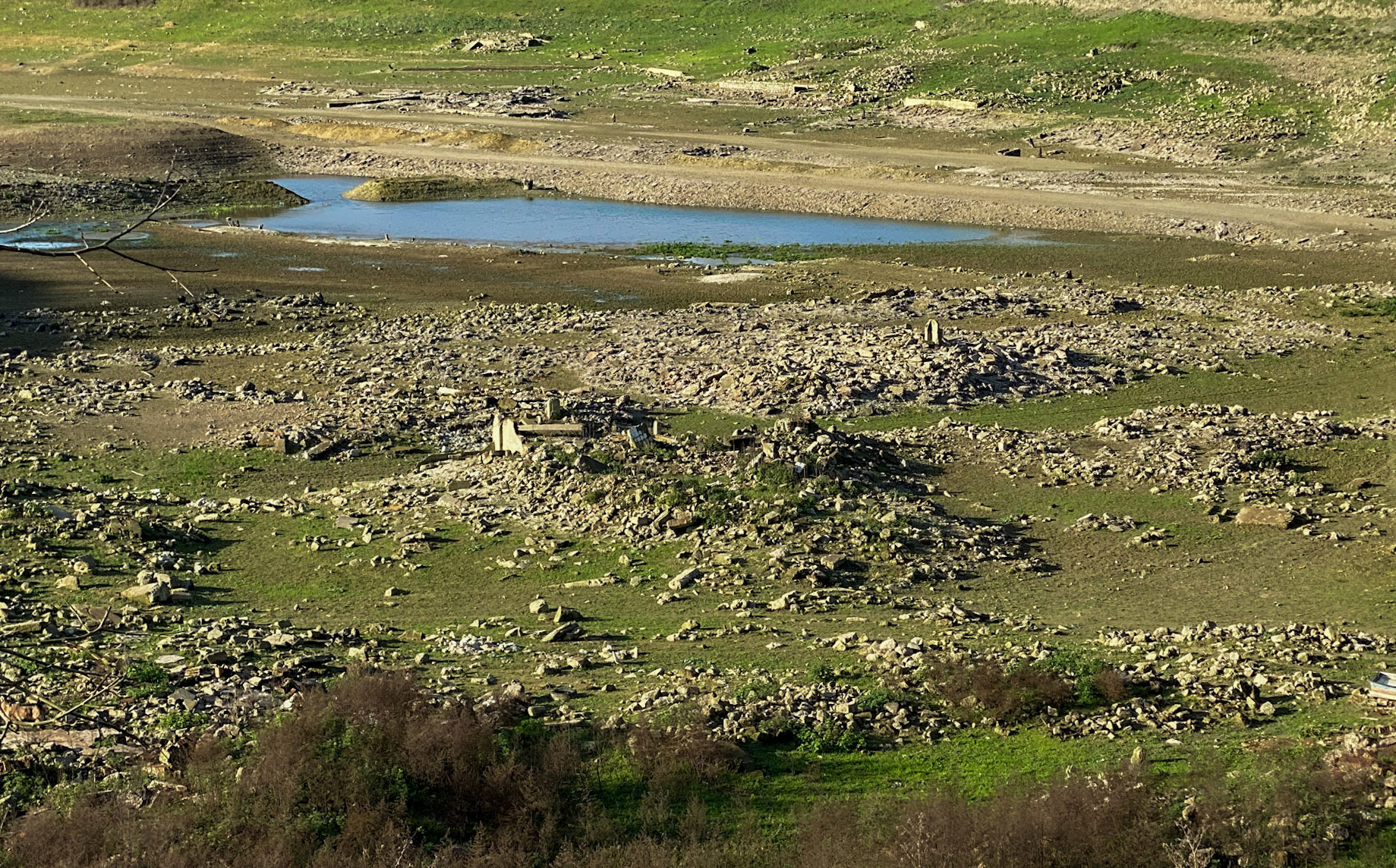 Şamlar: the almost-dry Sazlıdere reservoir bed south of the village; note the long-submerged ruins