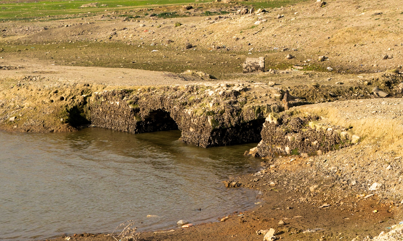 Şamlar: the long-submerged Ottoman bridge in the almost-dry Sazlıdere reservoir bed south of the village