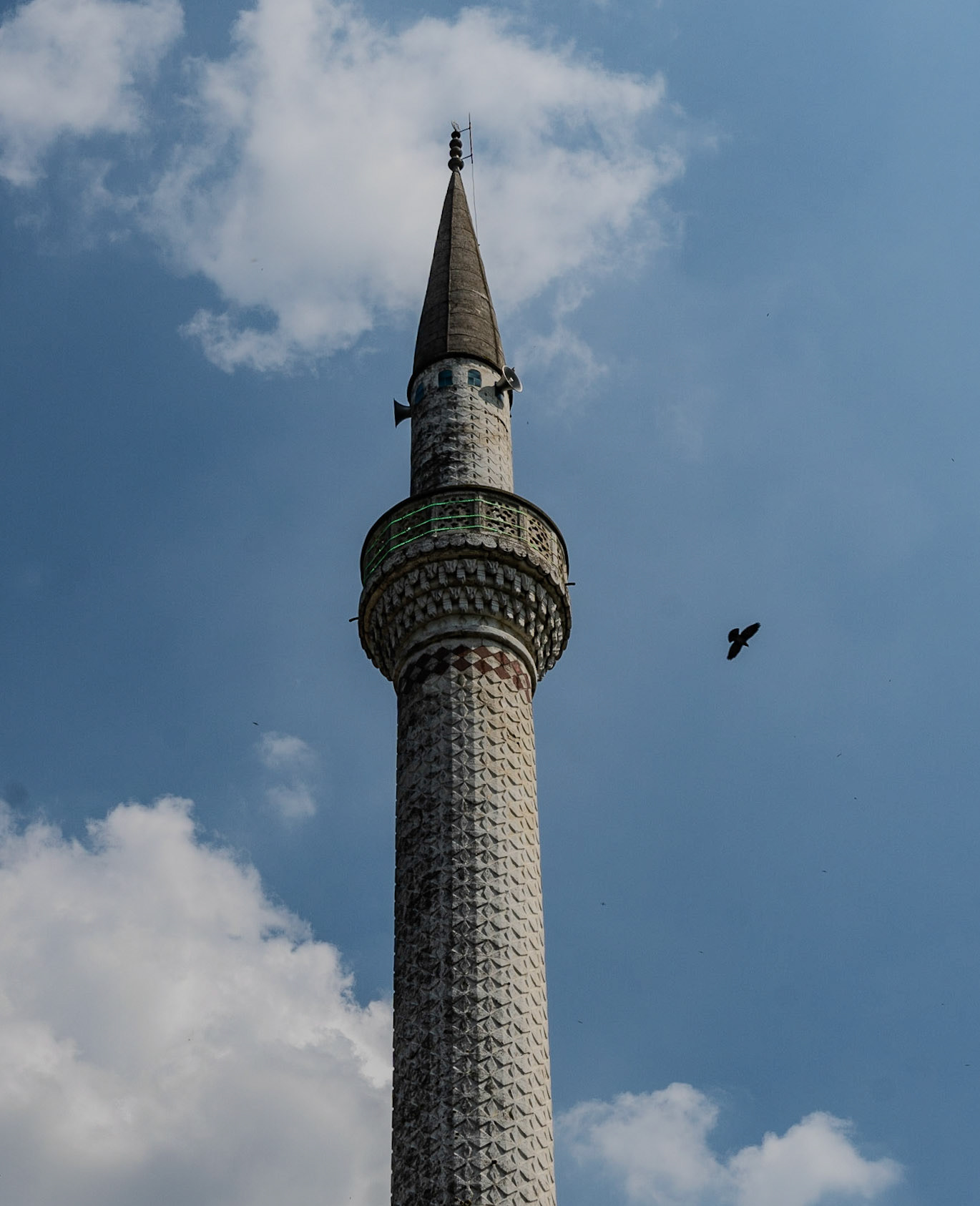 Şamlar: the Ottoman minaret with a bird flying above it
