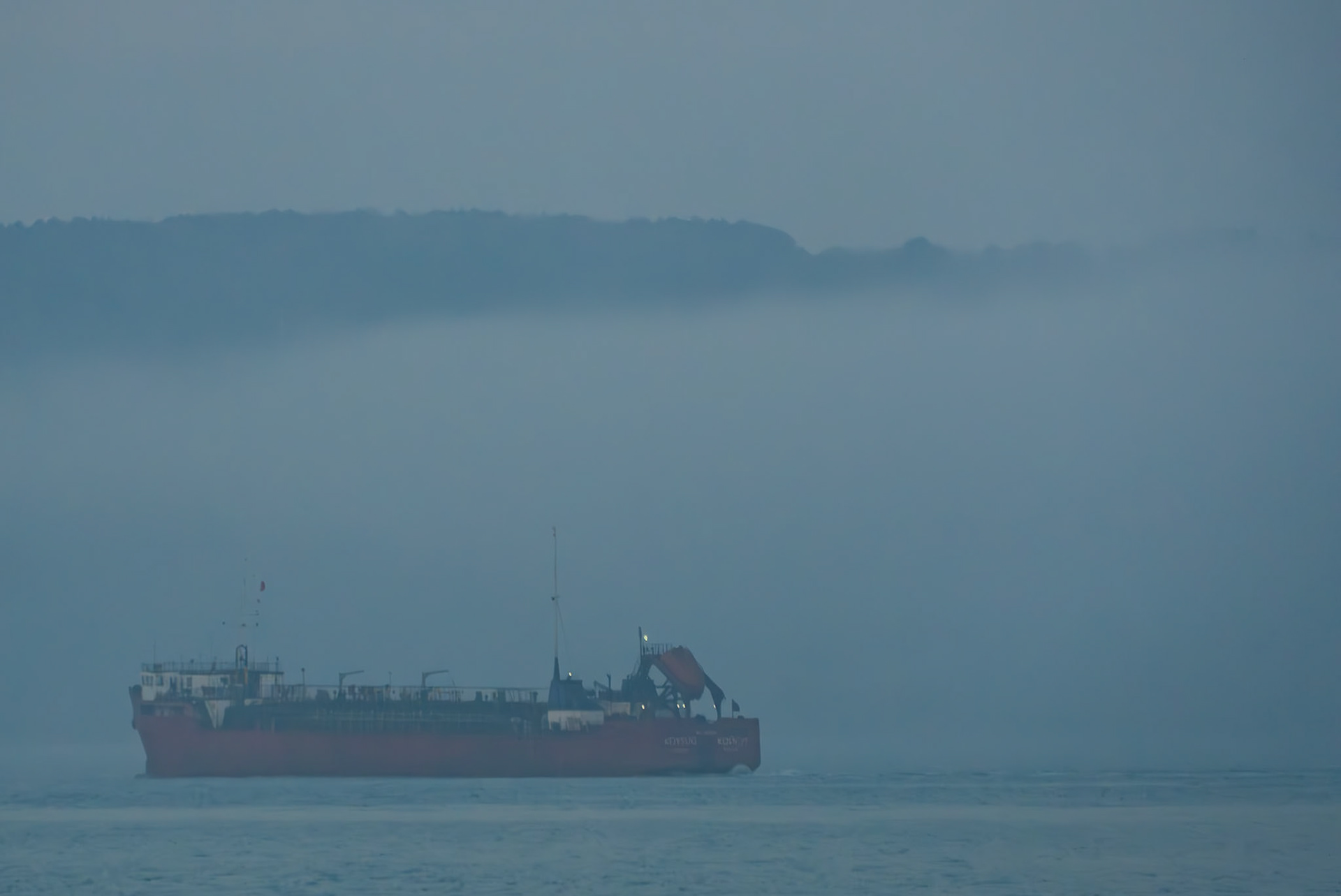 on the ferry between Anadolu Kavaǧı and Yeniköy: red ship in the evening mist