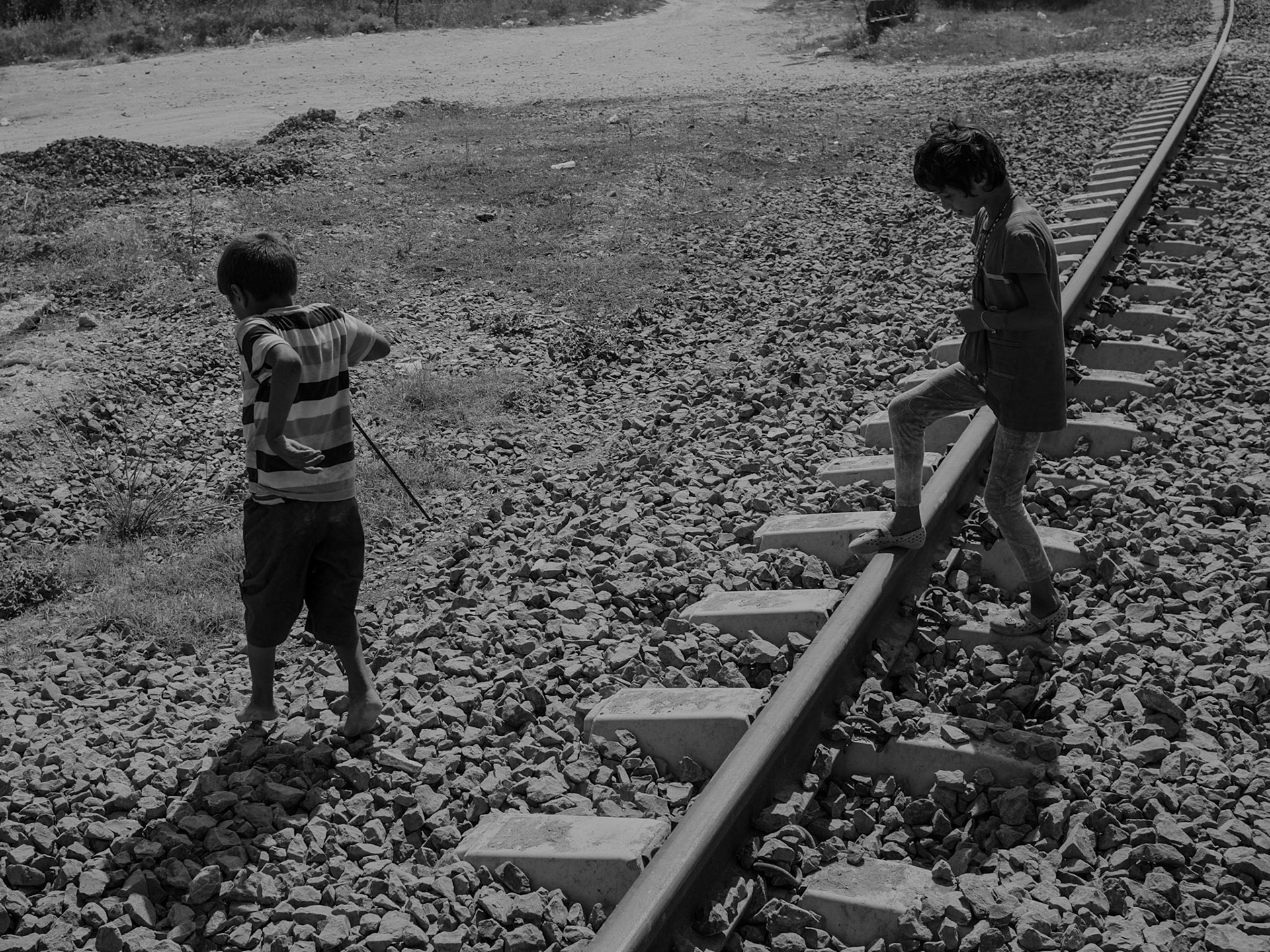 southwest of Altınşehir: two cheeky, thin Roma kids on the then-disused railway line