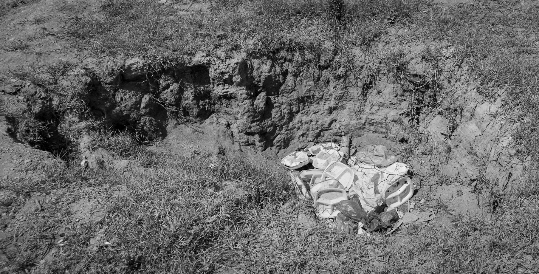 Güzelce aqueduct: treasure-hunters' pit (probably) &amp; litter