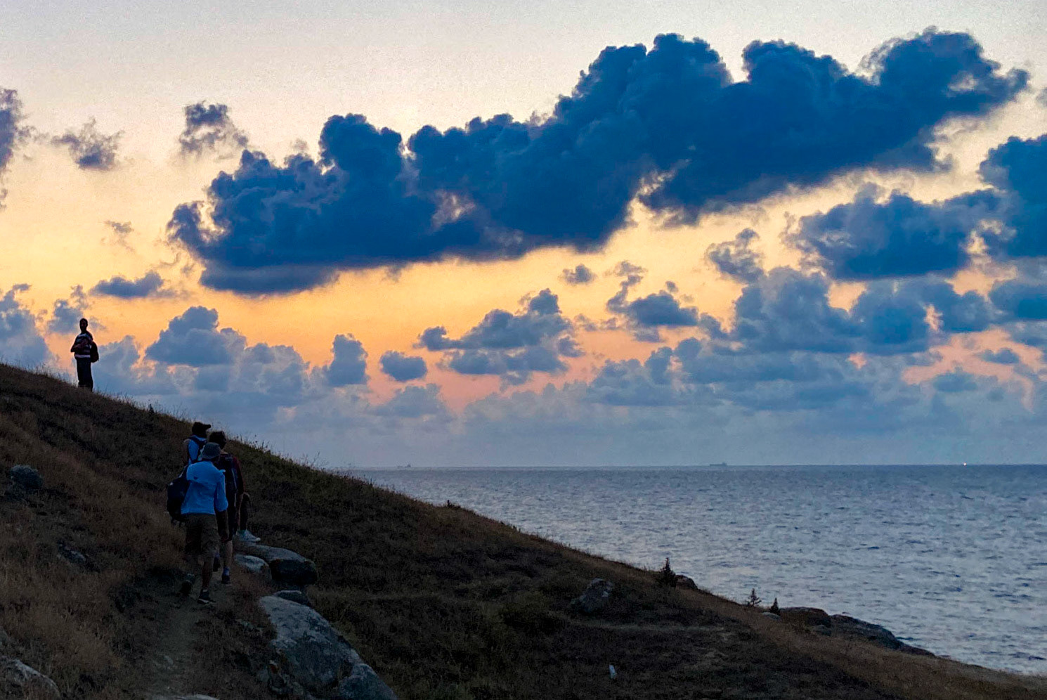 between the 'English' houses and Riva: the setting sun looking west along the shore
