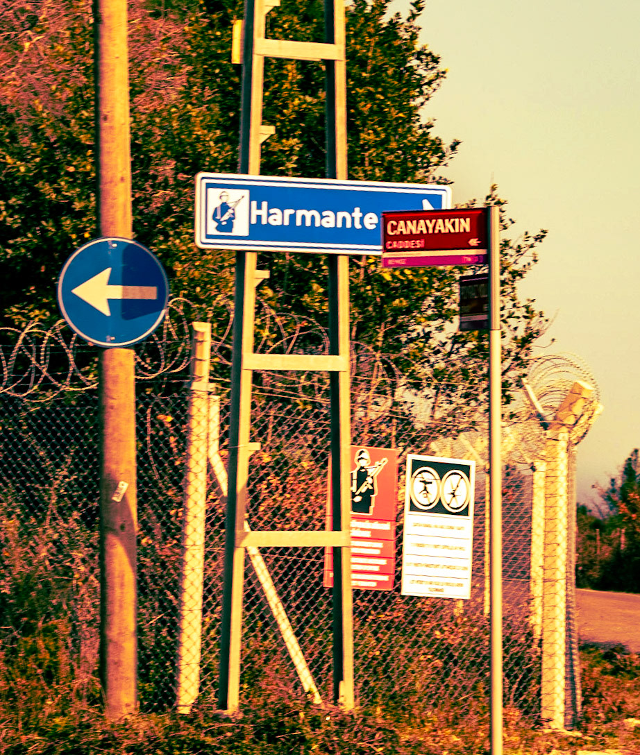 KYK wood: signs and a military fence