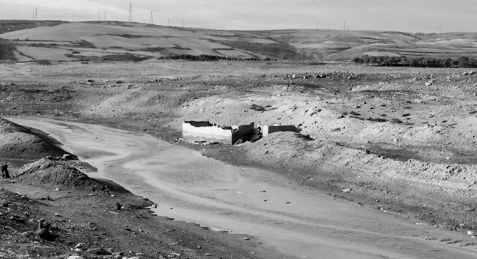 Şamlar: the almost-dry Sazlıdere reservoir bed south of the village; note the long-submerged ruins
