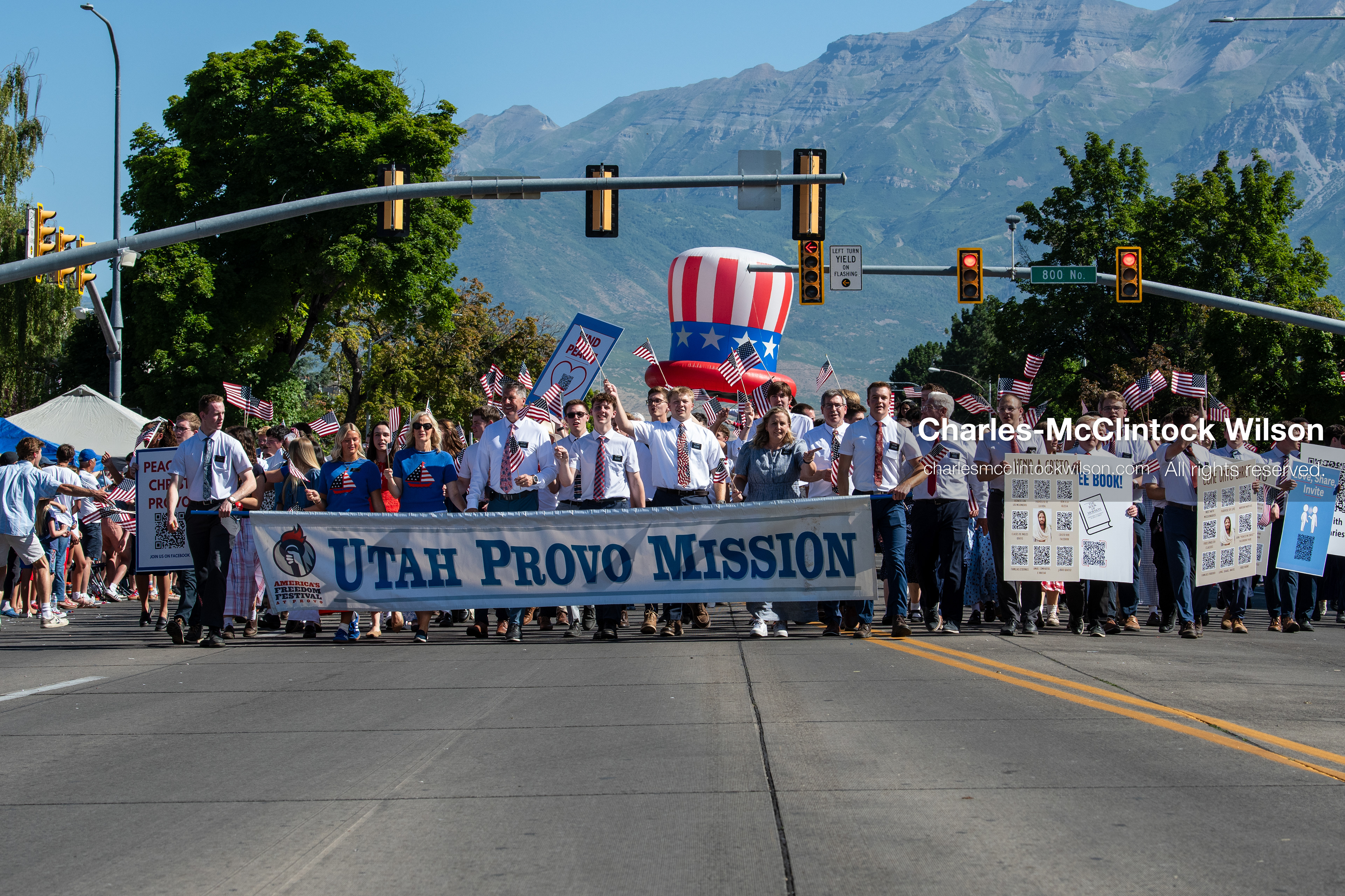 July 4, 2026, Provo, Utah, USA: Missionaries from The Church of Jesus Christ of Latter-day Saints wear black name badges and wave American flags while marching down the street during America's Freedom Festival Grand Parade in Provo, Utah, Saturday, July 4, 2026. The annual Independence Day event features expanded programming to honor the 250th anniversary of United States independence. (Credit Image: © Charles-McClintock Wilson/ZUMA Press Wire)