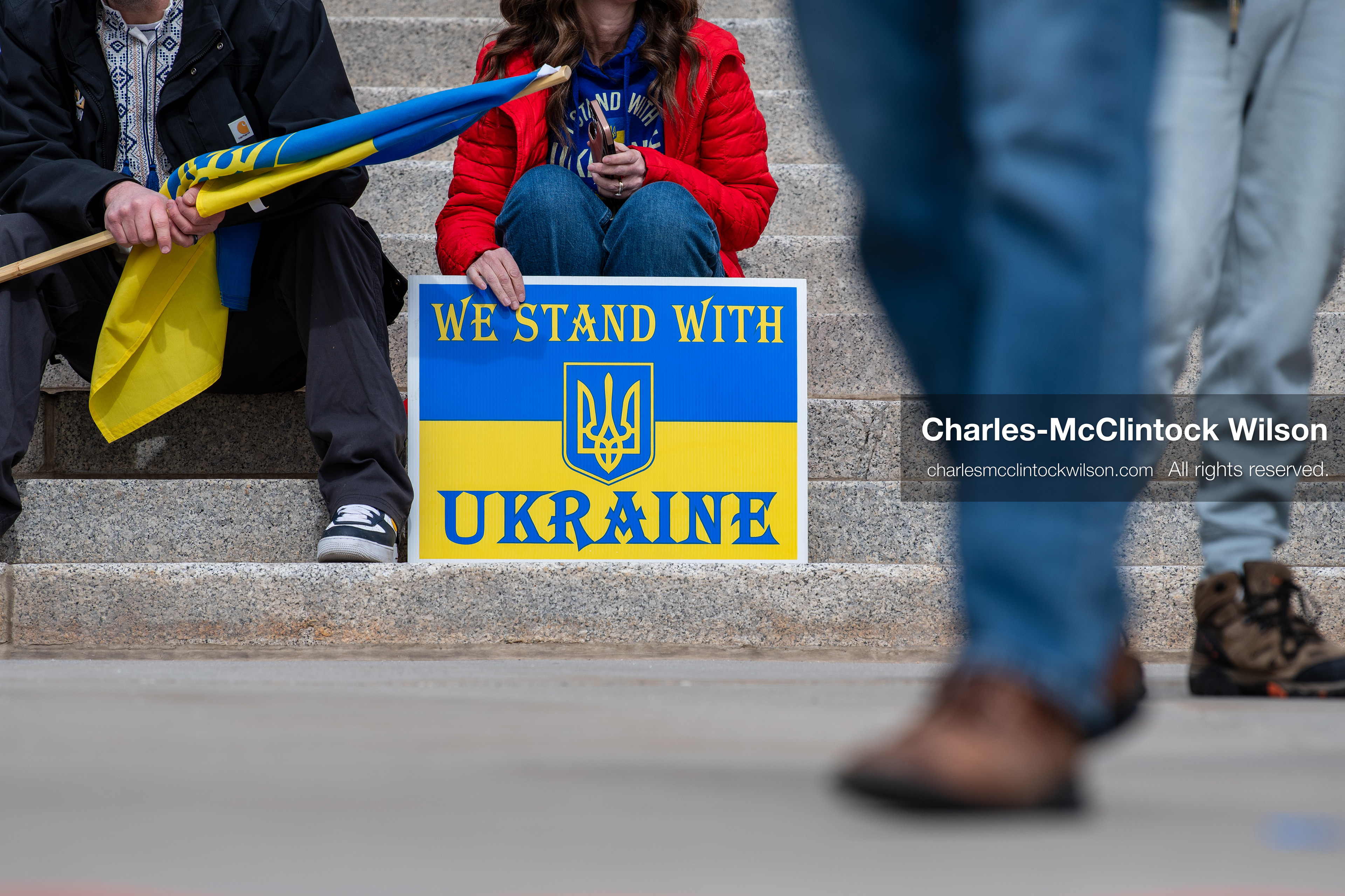 February 28, 2026, Salt Lake City, Utah, USA: A demonstrator holds a sign reading We Stand With Ukraine in the colors of the Ukrainian flag during the Stand With Ukraine rally at the Utah State Capitol. The gathering marked the four year anniversary of the full scale Russian invasion of Ukraine and brought community members together in support of Ukrainians and local humanitarian efforts. (Credit Image: © Charles McClintock Wilson/ZUMA Press Wire)