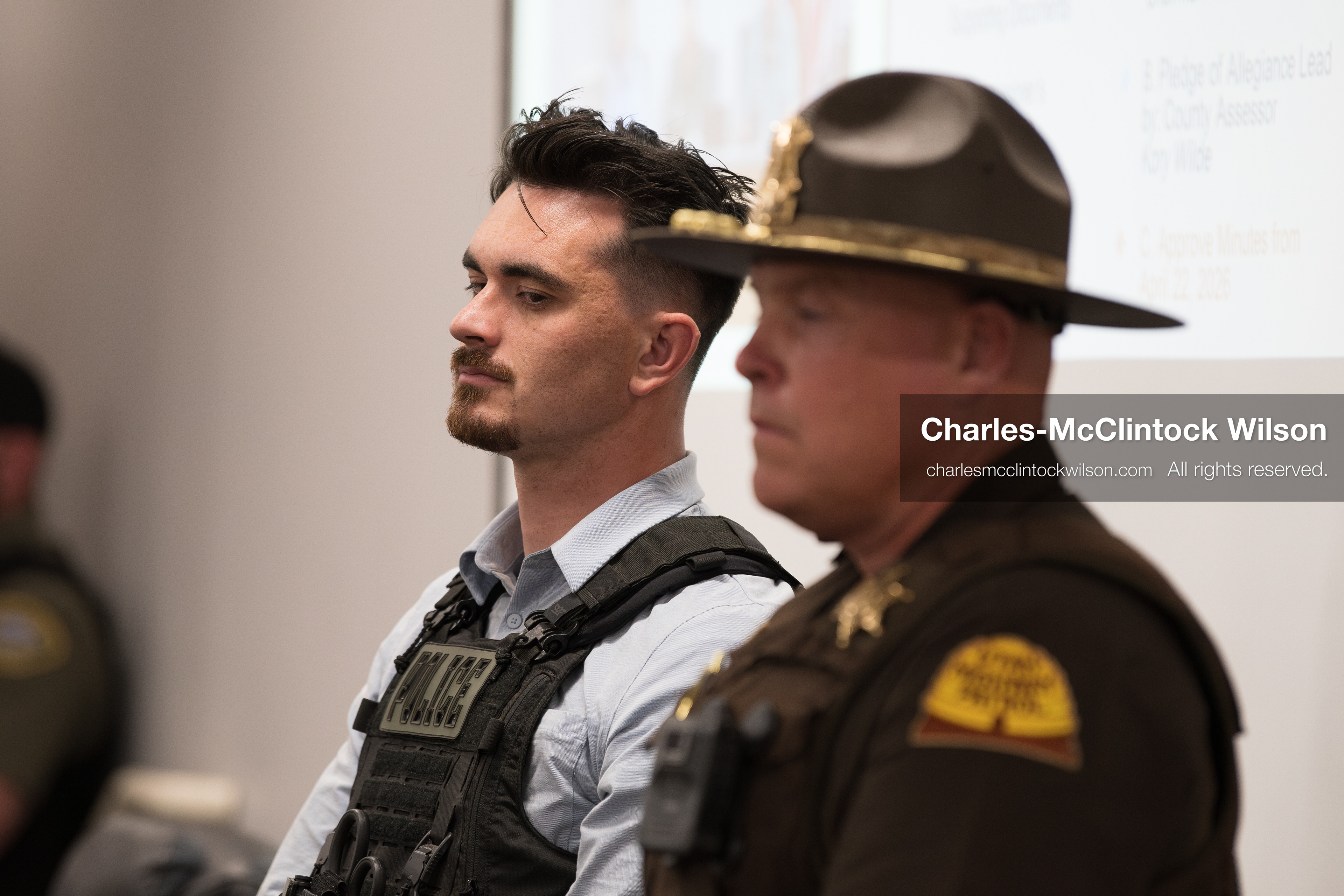 May 13, 2026, Brigham City, Utah, USA: A Box Elder County Sheriff’s Office deputy and a Utah Highway Patrol trooper stand inside the Box Elder County Justice Center in Brigham City, Utah, as residents attend a public meeting over the proposed data‑center project backed by businessman Kevin O’Leary, which has drawn public concern over water use, power demand, and transparency. (Credit Image: © Charles‑McClintock Wilson/ZUMA Press Wire)