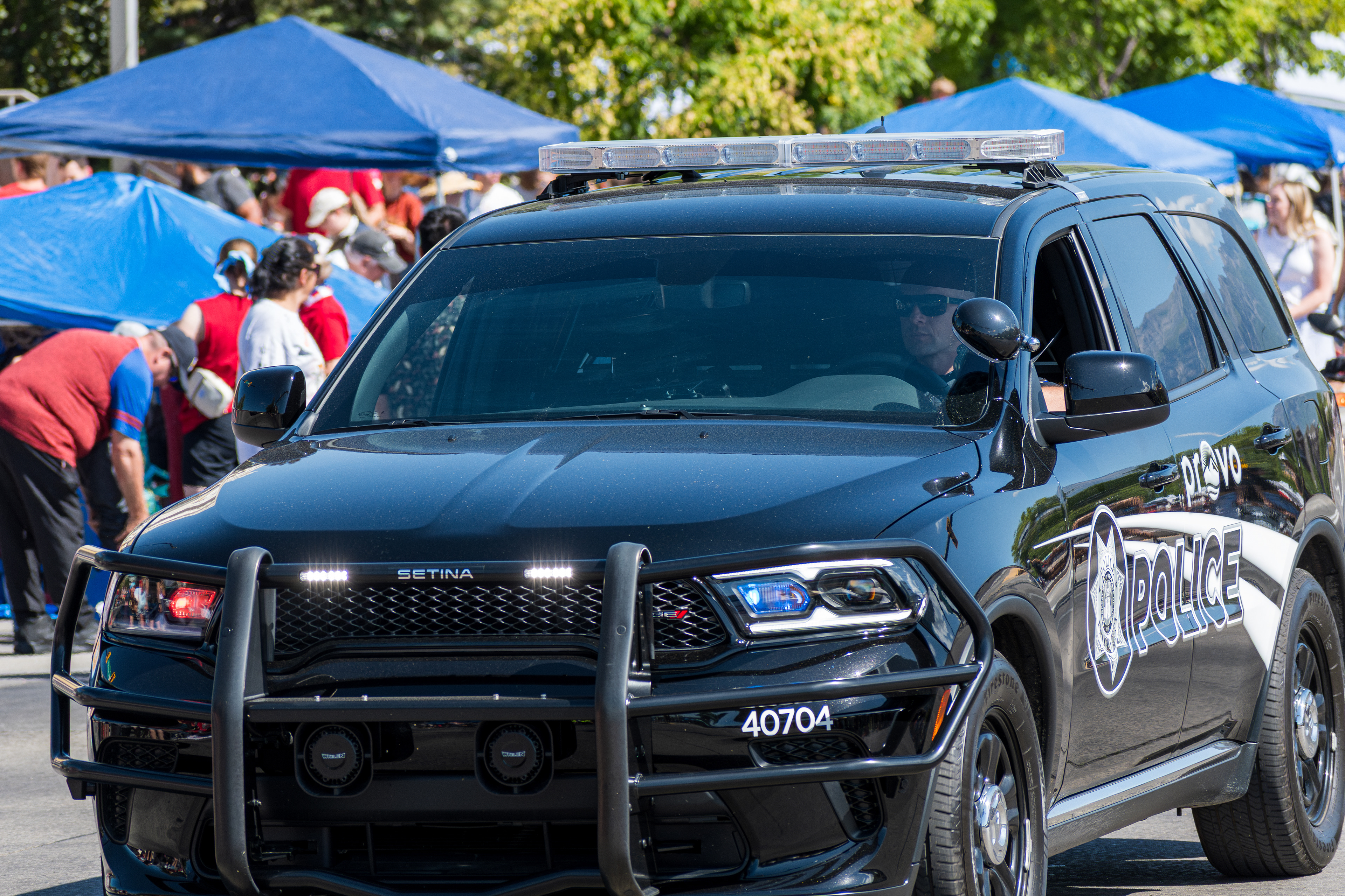 Provo, Utah – July 4, 2025: A Provo Police Department cruiser is parked on the road during the Freedom Festival Grand Parade in downtown Provo.