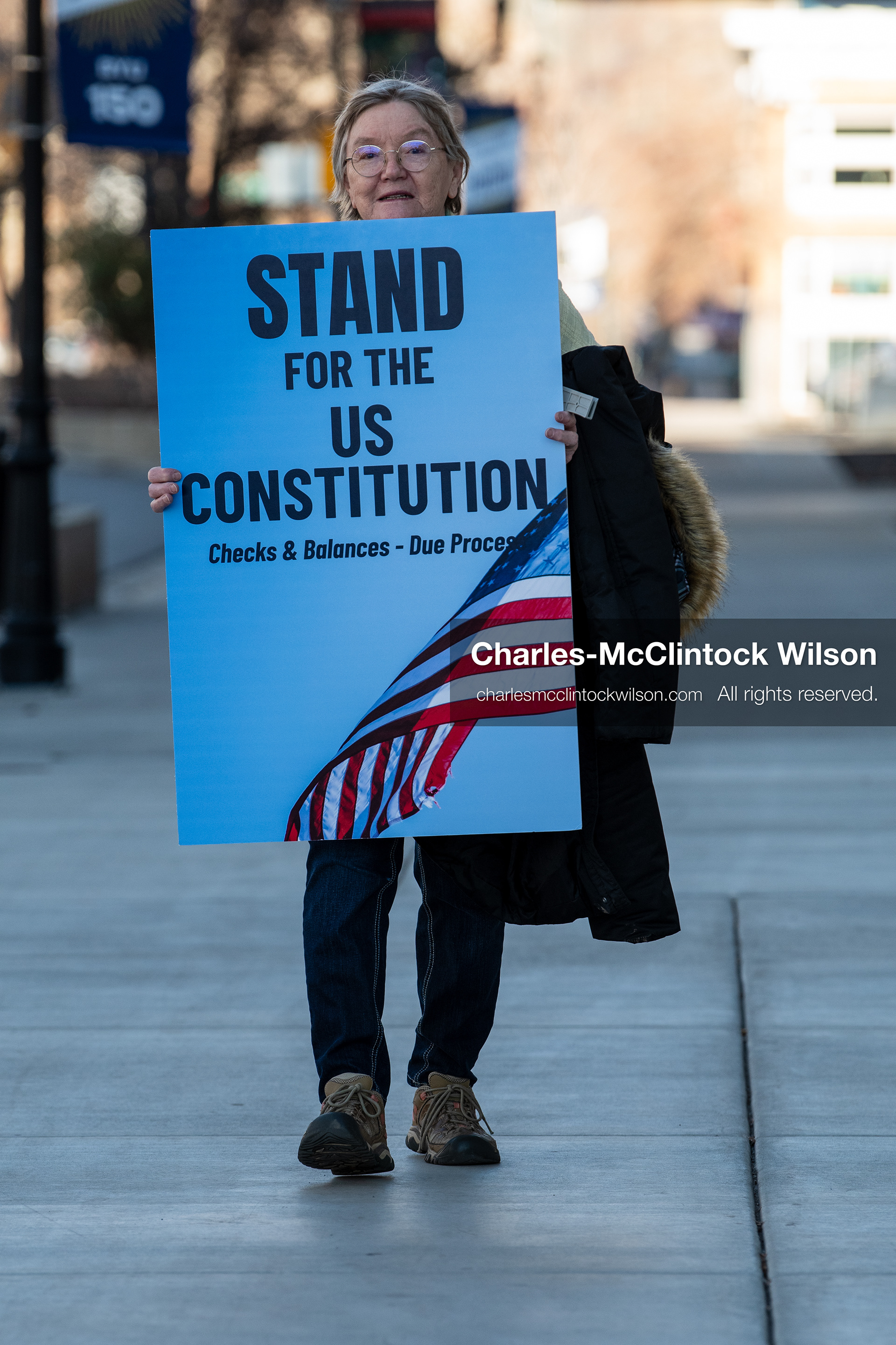 January 20, 2026, Provo, Utah, USA: A demonstrator stands outside Provo City Hall during the Free America Walkout protest in Provo Utah on January 20 2026. The nationwide event called for immigration reform and changes to detention practices. 