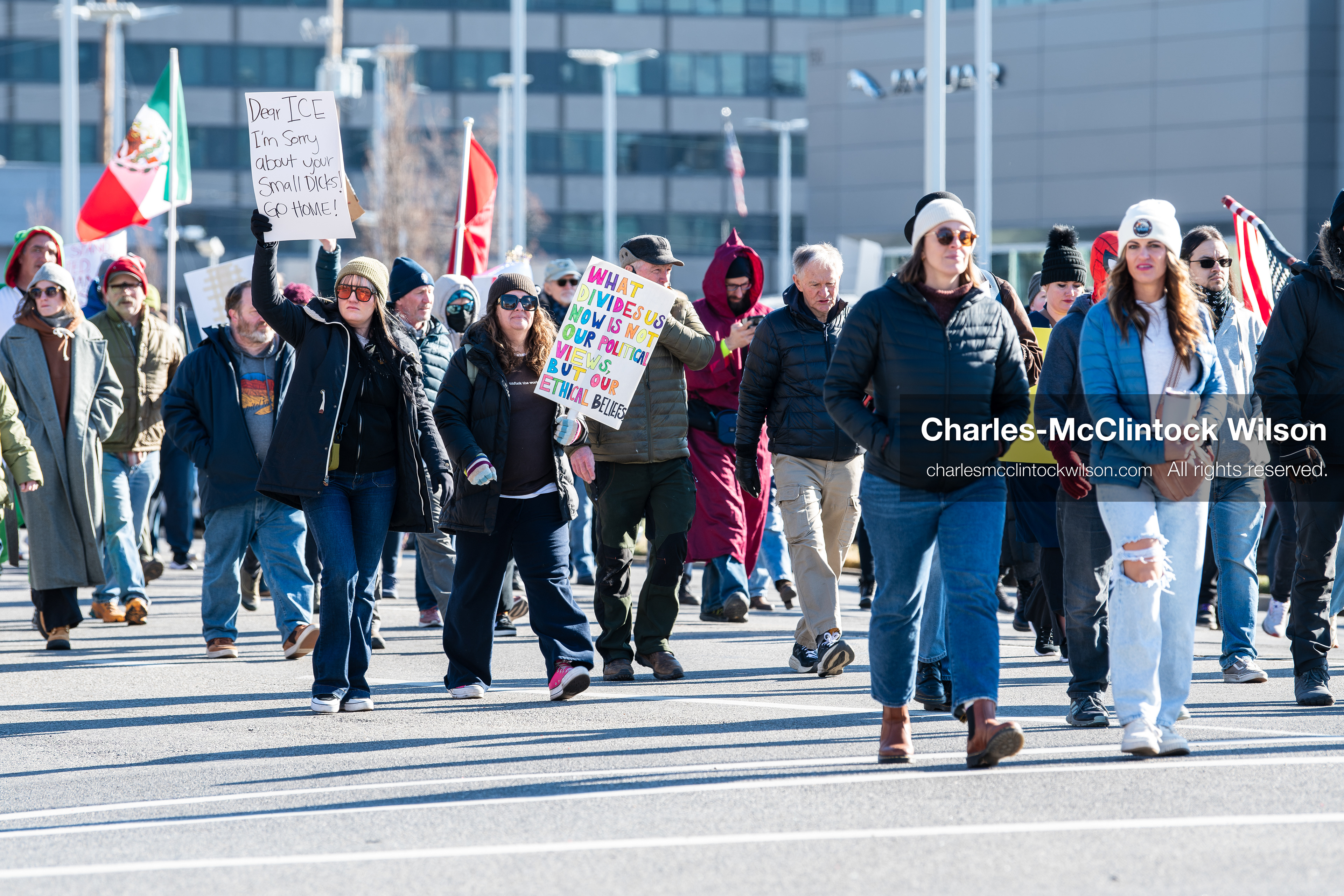 Salt Lake City, Utah, January 10, 2026: A group of demonstrators marches through downtown Salt Lake City during the ICE Out for Good protest, which began at Washington Square Park, with participants carrying signs and personal items as they walk together. (Credit Image: © Charles‑McClintock Wilson/ZUMA Press Wire)