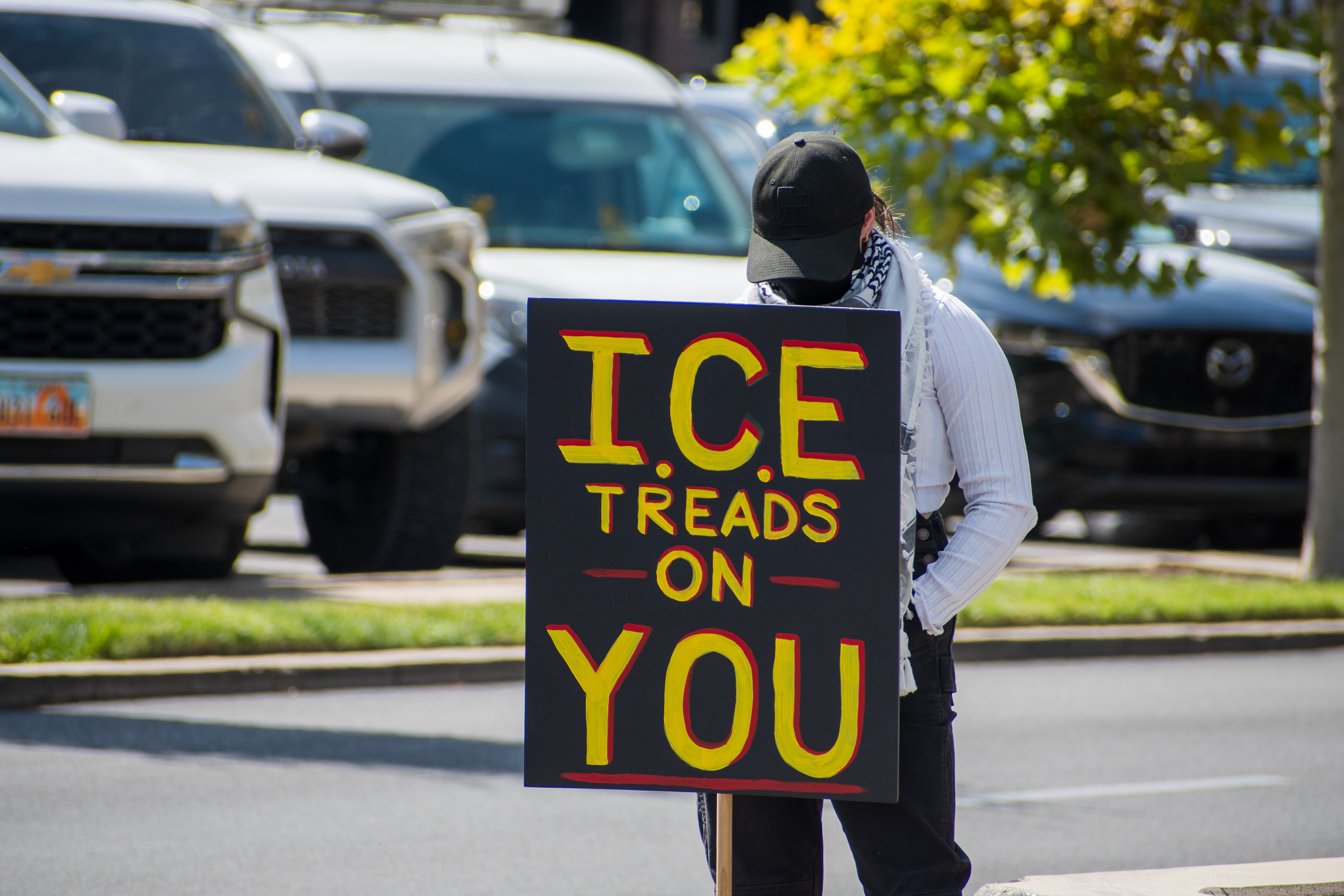 September 15, 2025 – Provo, Utah, United States: A demonstrator holds a sign reading “ICE TREADS ON YOU” outside the Utah Valley Convention Center during a protest against the Department of Homeland Security career expo. The phrase evokes the historic “Don’t Tread on Me” slogan, reframed to critique immigration enforcement practices. Photograph by Charles‑McClintock Wilson / ZUMA Press Wire