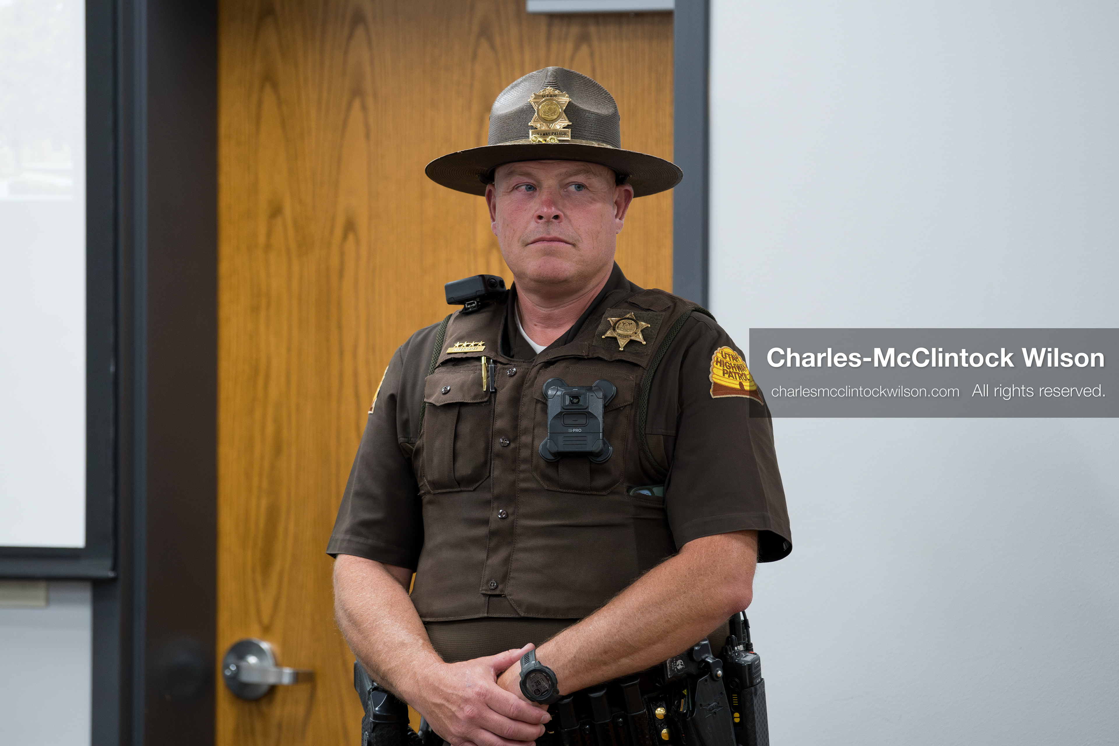 May 13, 2026, Brigham City, Utah, USA: A Utah Highway Patrol trooper stands inside the Box Elder County Justice Center in Brigham City, Utah, as residents gather for a public meeting over the proposed data‑center project backed by businessman Kevin O’Leary, which has drawn public concern over water use, power demand, and transparency. (Credit Image: © Charles‑McClintock Wilson/ZUMA Press Wire)