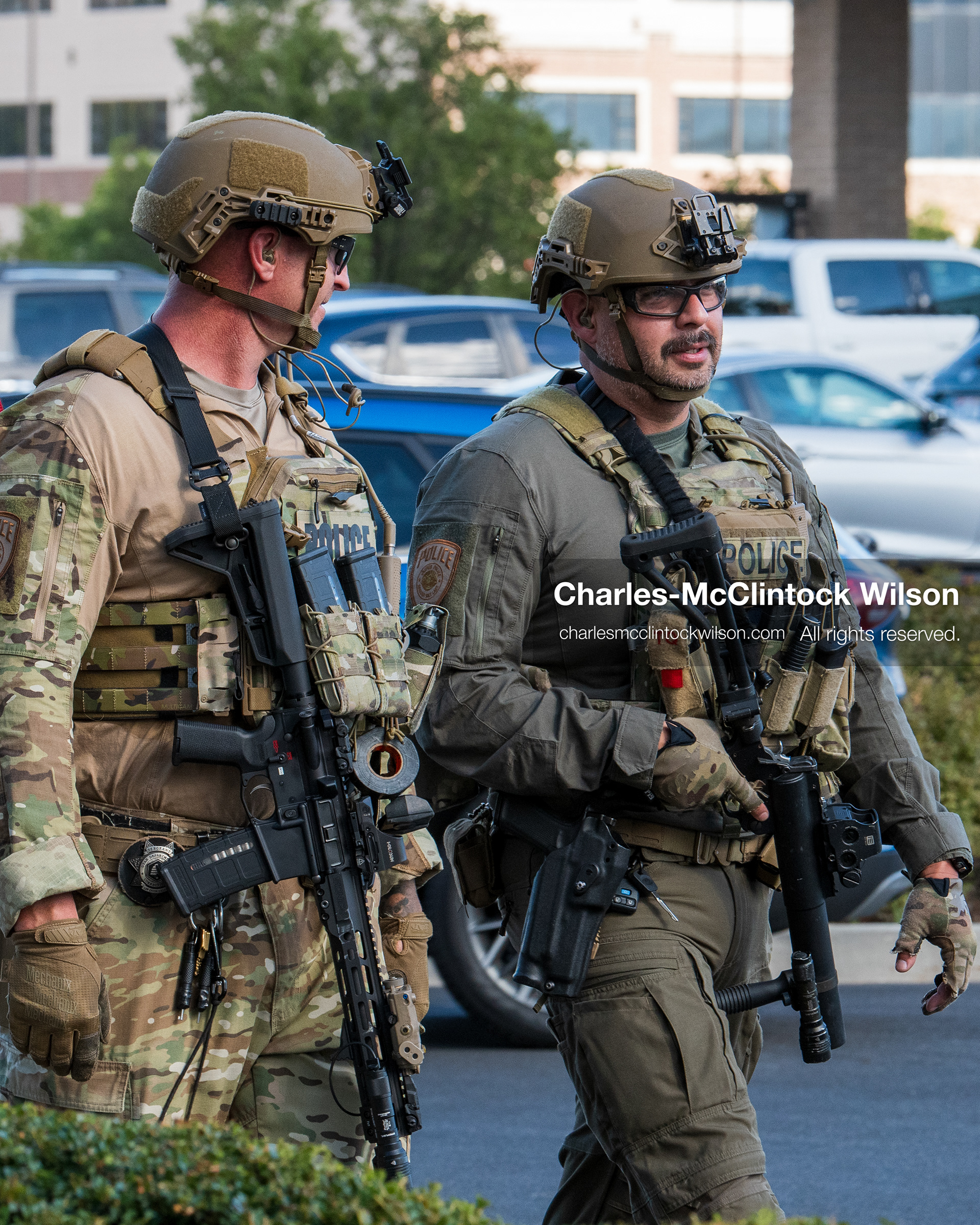 August 17, 2026, Murray, Utah, USA: Two armed law enforcement officers in tactical gear patrol the parking lot outside Intermountain Medical Center on Monday. Multiple police agencies secured the hospital perimeter as a safety precaution after shooting victims were brought in from a fatal shootout outside a funeral in nearby Kearns. (Credit Image: © Charles McClintock Wilson/ZUMA Press Wire)