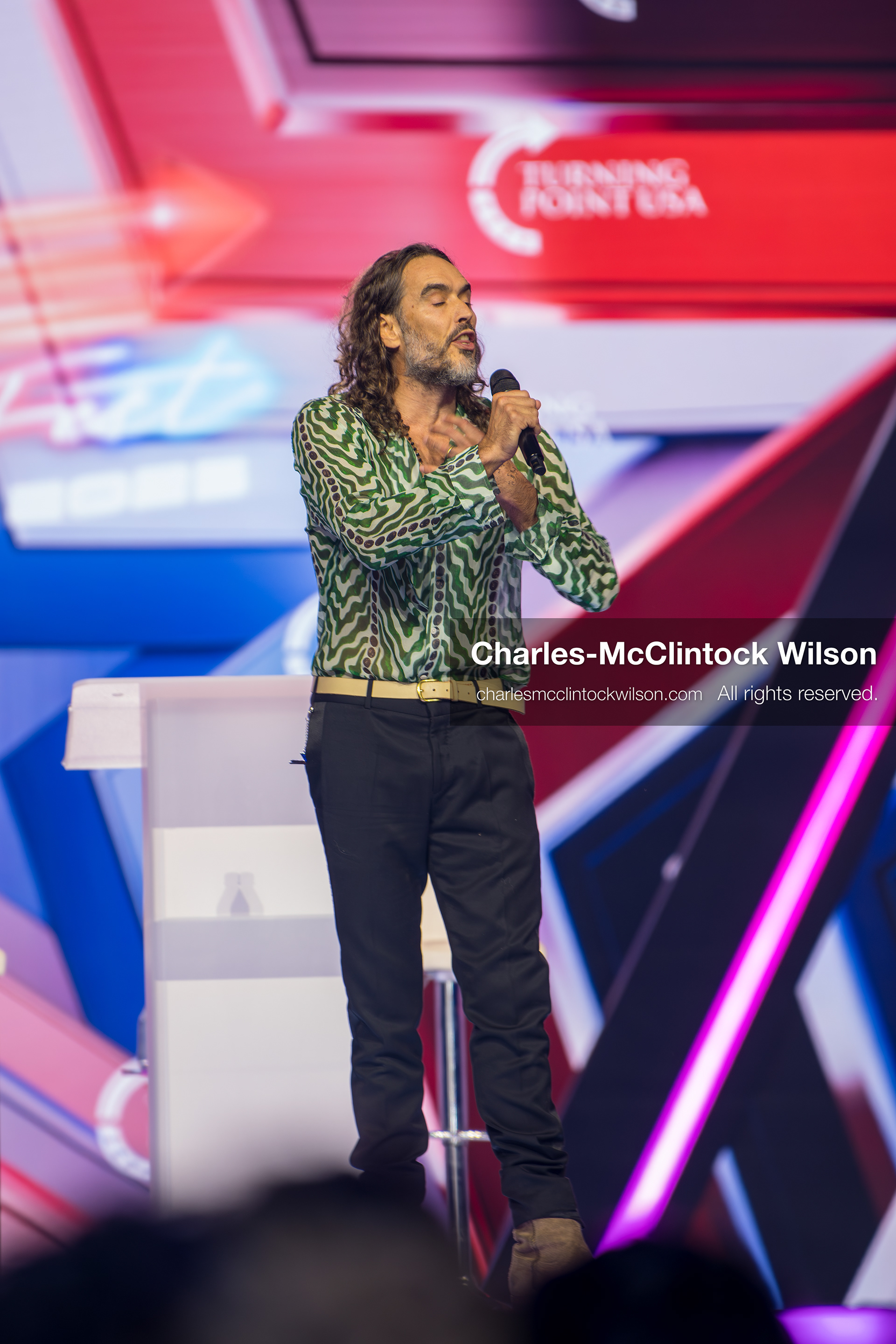 December 18, 2025, Phoenix, Arizona, USA: Russell Brand speaks during Day One of Turning Point USA’s AmericaFest 2025 at the Phoenix Convention Center in Phoenix, Arizona.   (Credit Image: © Charles‑McClintock Wilson/ZUMA Press Wire)