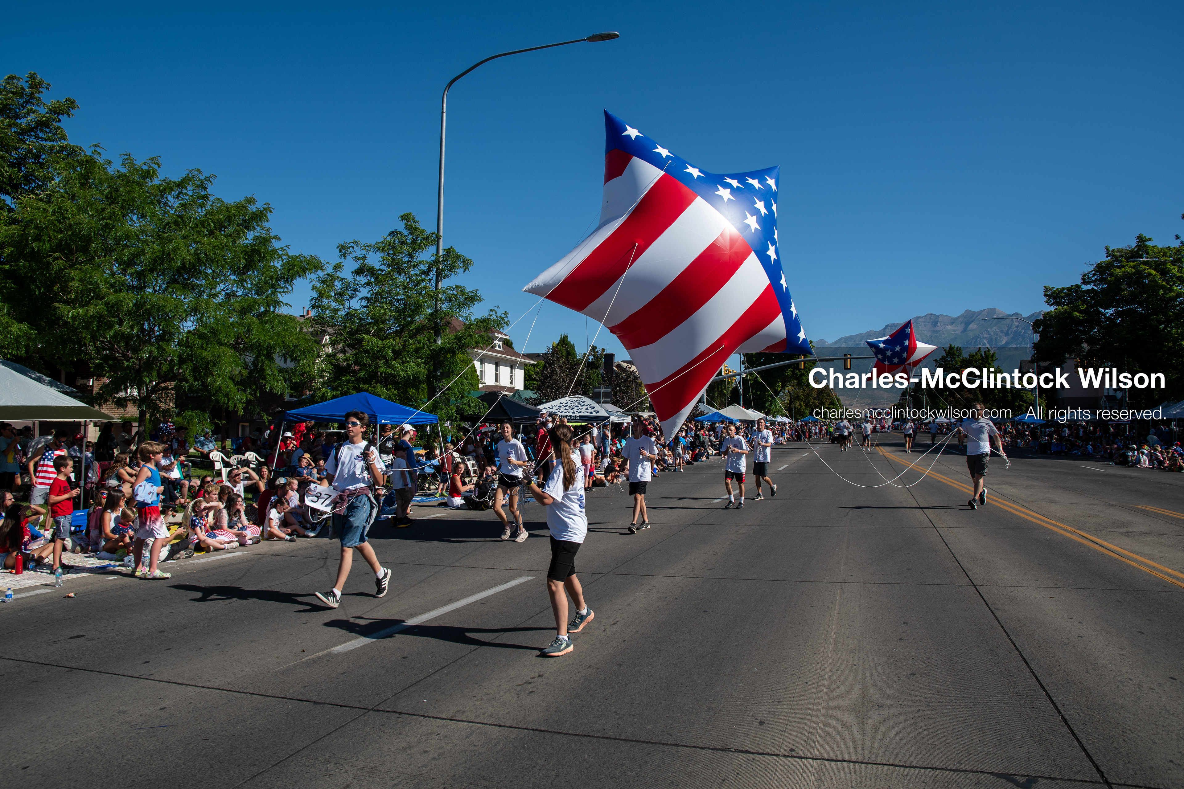  July 4, 2026, Provo, Utah, USA: Handlers navigate a giant, star-shaped patriotic helium balloon decorated with stars and stripes down University Avenue during America's Freedom Festival Grand Parade in Provo, Utah, Saturday, July 4, 2026. The annual Independence Day event features expanded programming to honor the 250th anniversary of United States independence. (Credit Image: © Charles-McClintock Wilson/ZUMA Press Wire)