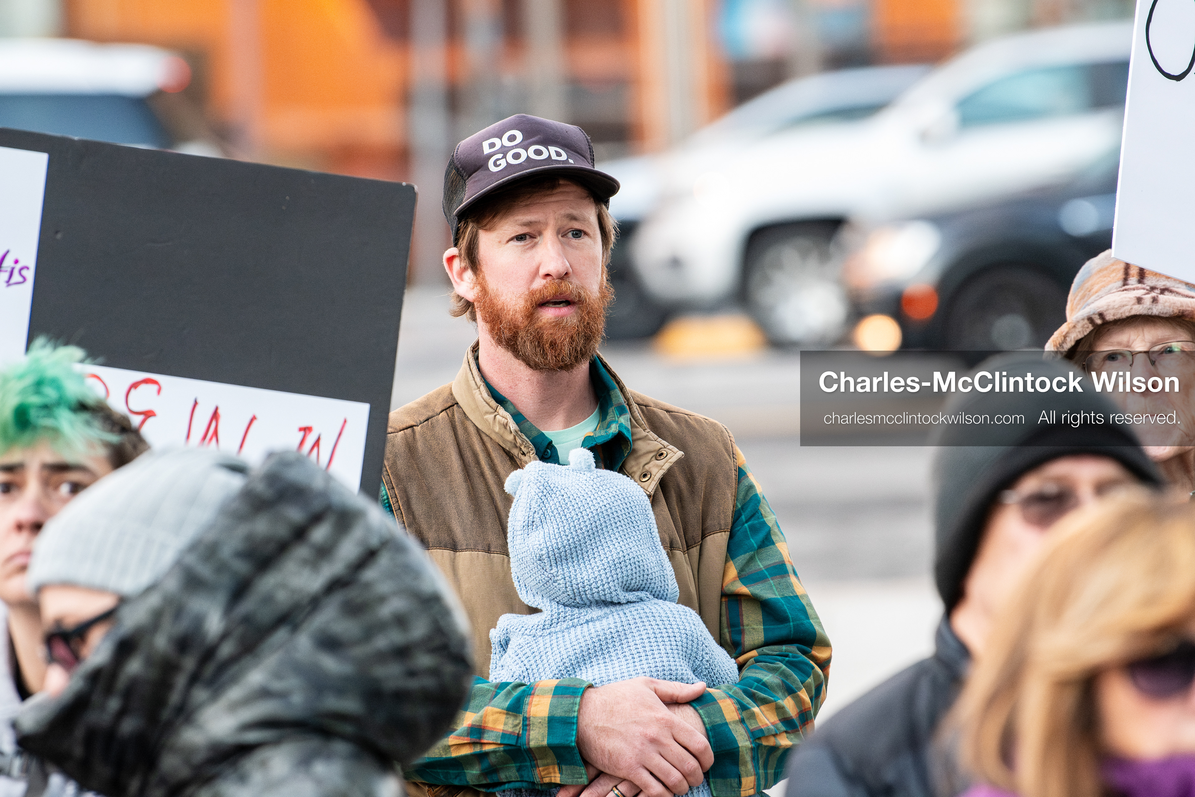 January 5, 2026, Salt Lake City, Utah, USA: A demonstrator holds a baby during a protest outside the Wallace Federal Building in Salt Lake City, Utah. The rally, organized by Salt Lake Indivisible, called for congressional limits on presidential war powers following recent US military actions in Venezuela involving the government of Nicolas Maduro. Attendees signed petitions addressed to Utah US senators Mike Lee and John Curtis. (Credit Image: (c) Charles‑McClintock Wilson/ZUMA Press Wire)