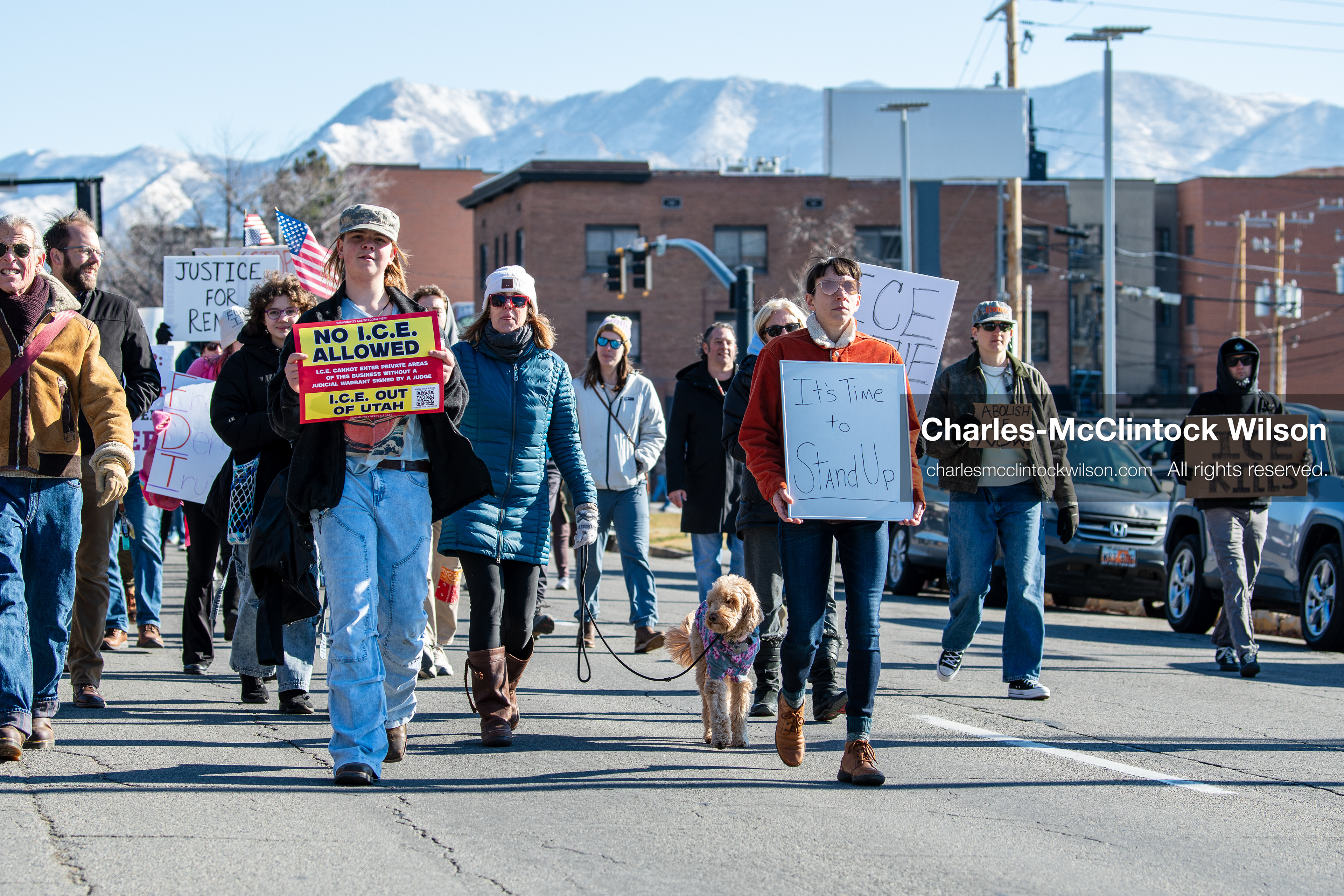 Salt Lake City, Utah, January 10, 2026: A group of demonstrators marches through downtown Salt Lake City during the ICE Out for Good protest, which began at Washington Square Park, with participants carrying signs and personal items as they walk together. (Credit Image: © Charles‑McClintock Wilson/ZUMA Press Wire)